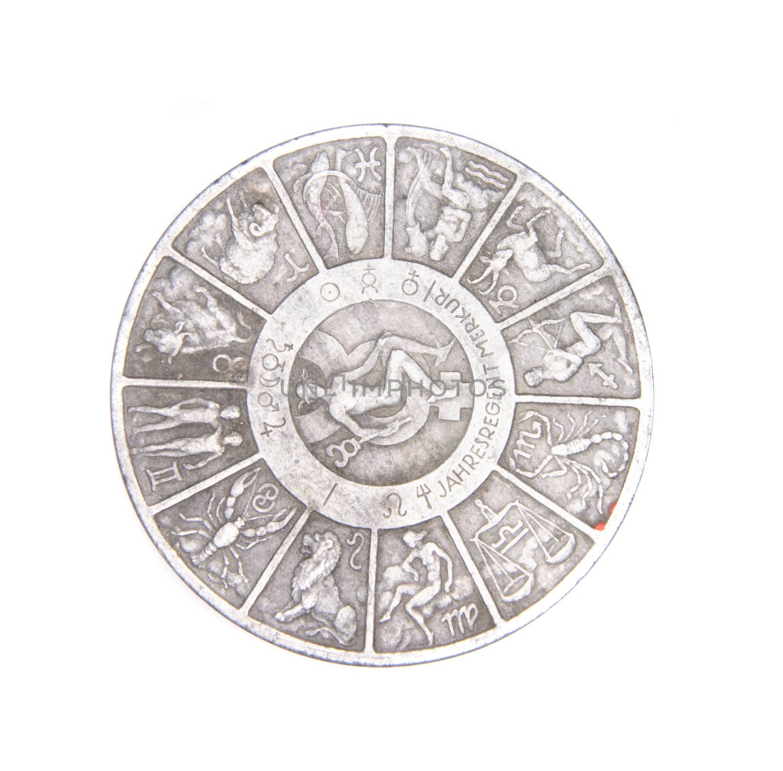 old silver coin with zodiac on the white background