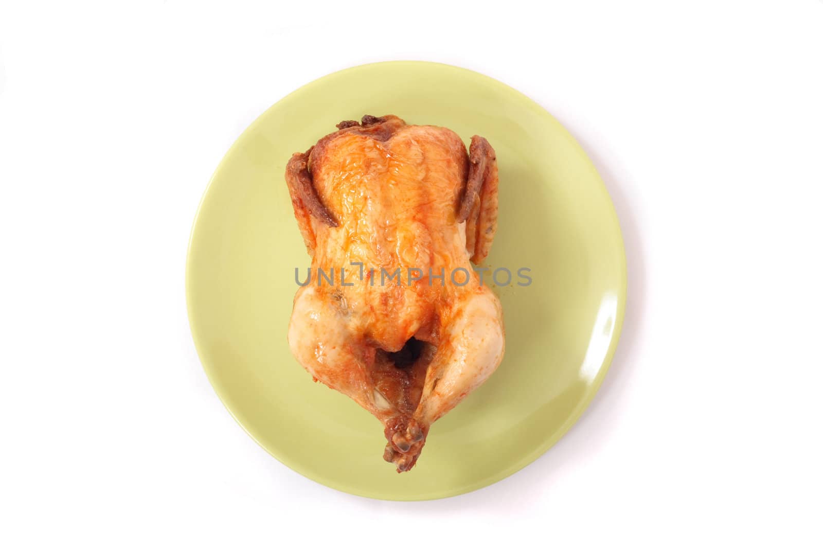 chicken on the green plate on the white background