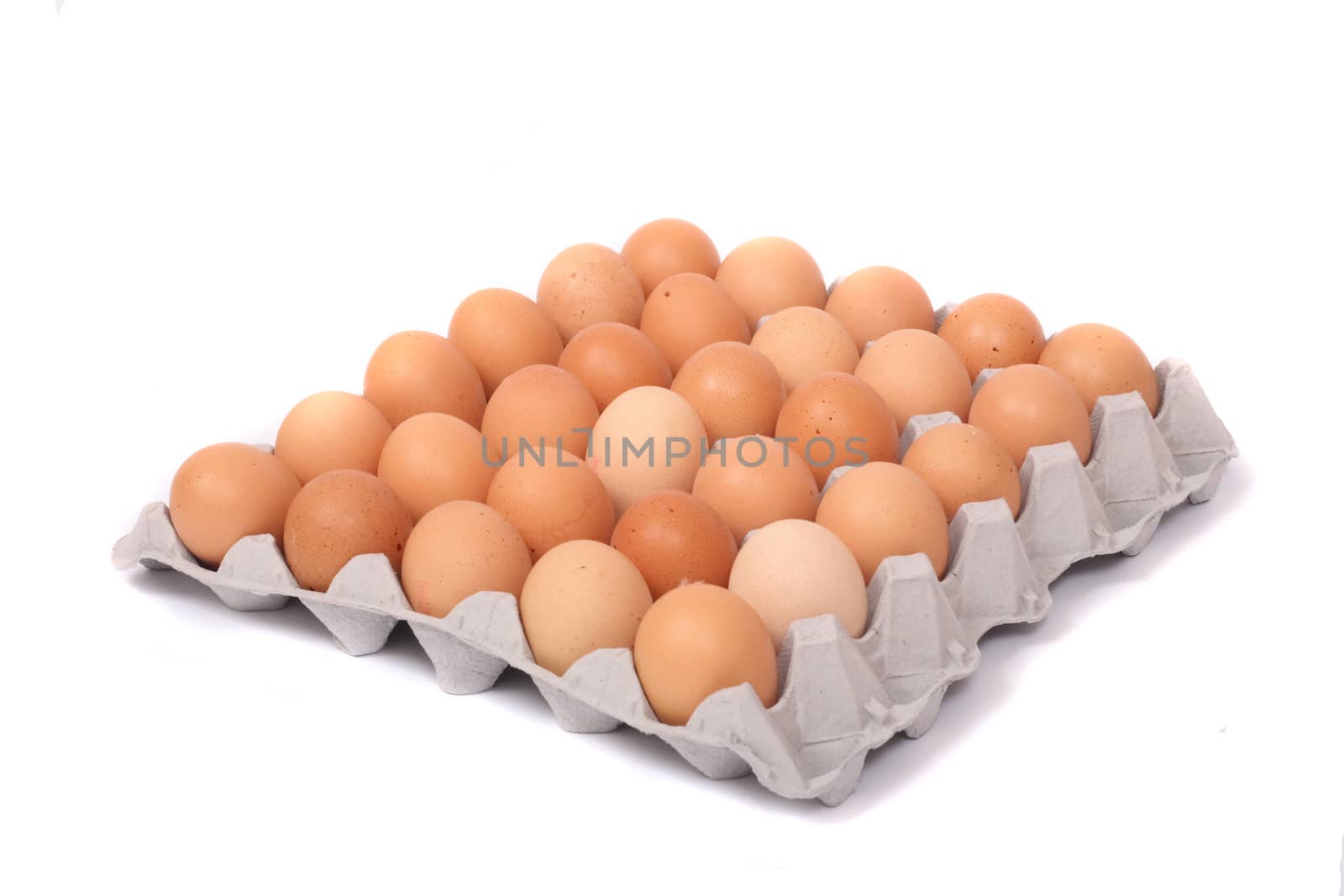 30 brown eggs on the white background