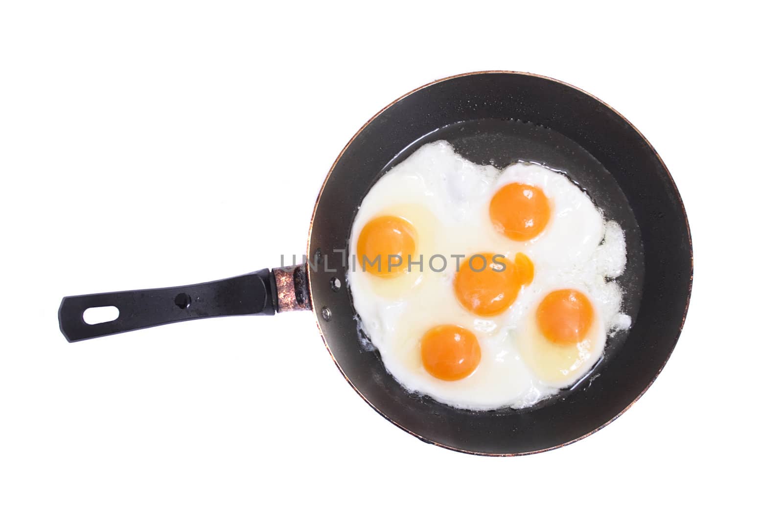 fried eggs on the pan on the whte background