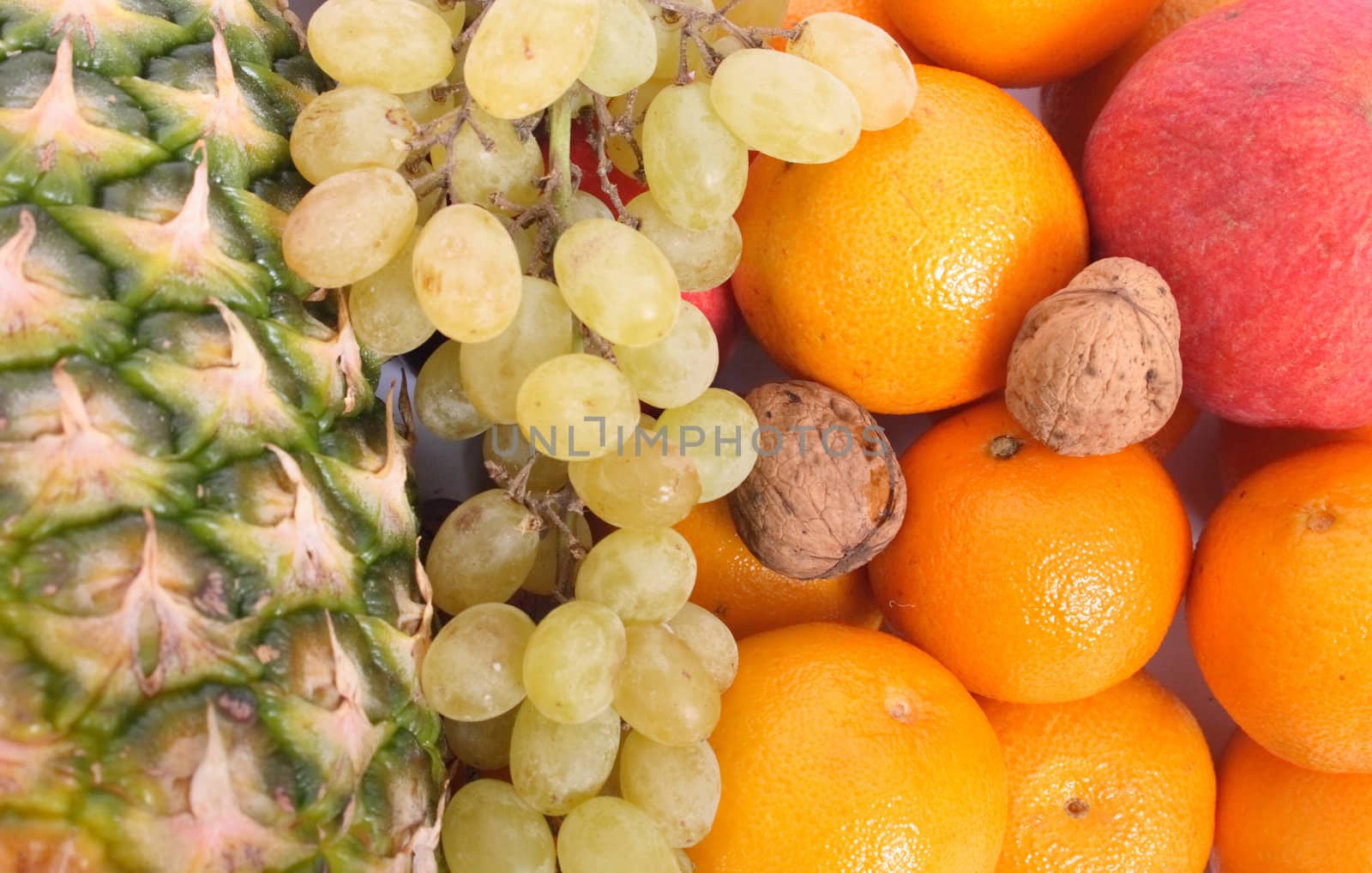 pineapple grapes , oranges as fruit background