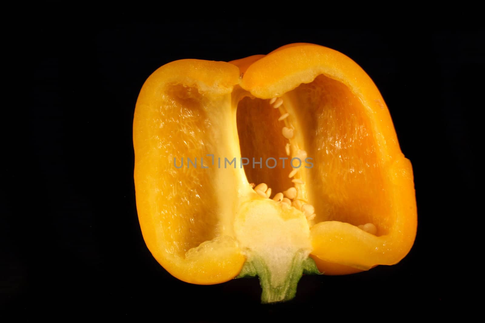 yellow fresh pepper bell on the black background