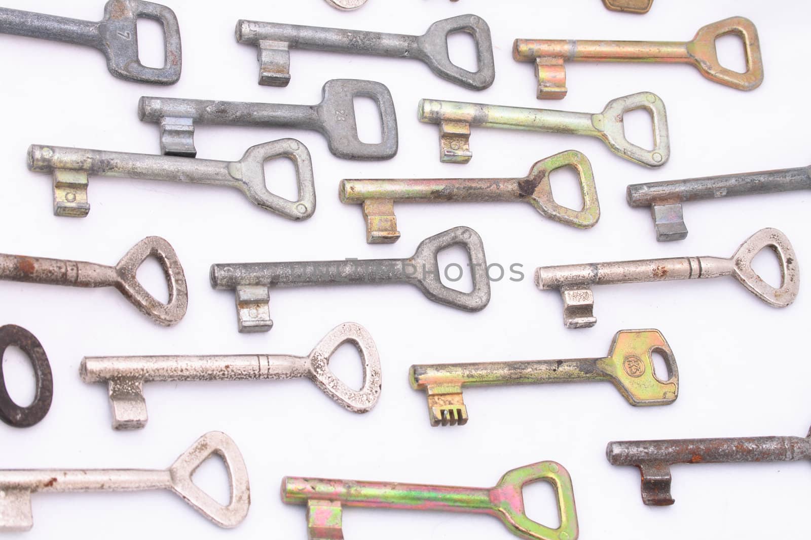 many old keys on the white background