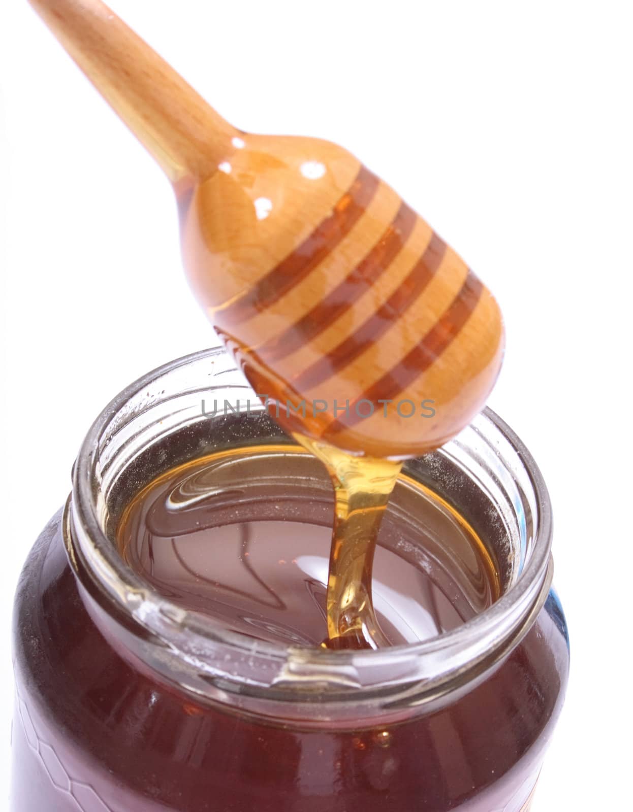 glass of honey on the white background