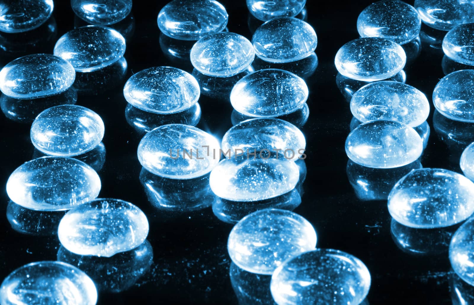 blue water drops on the black background 