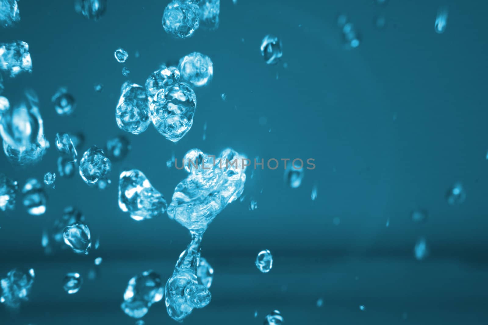 drops of water in the air in the blue color 