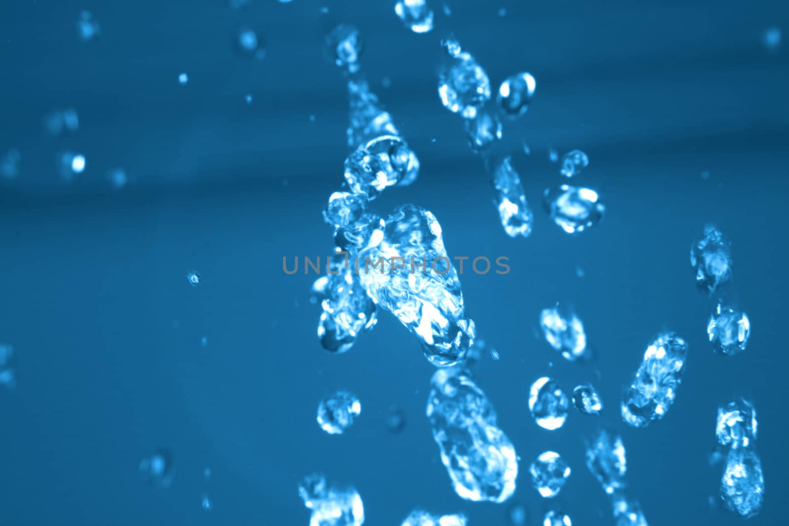 drops of water in the air in the blue color 