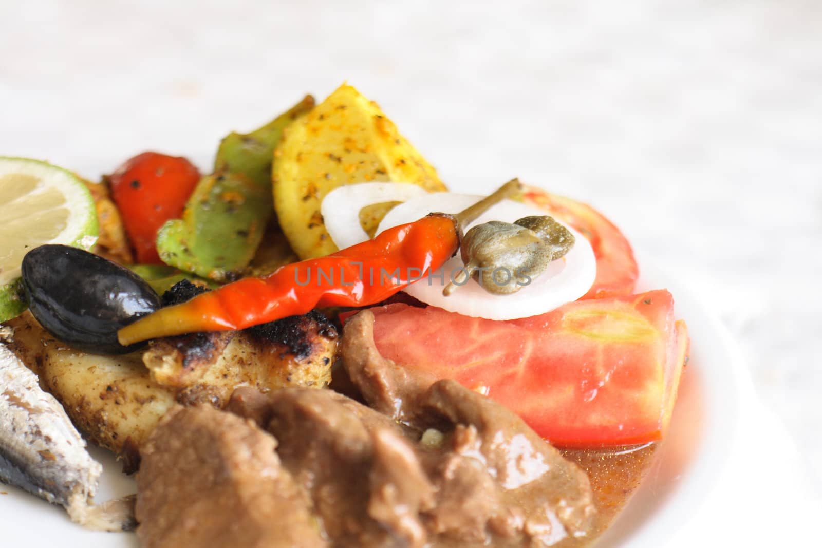 gourmet food with meat tomato and olives