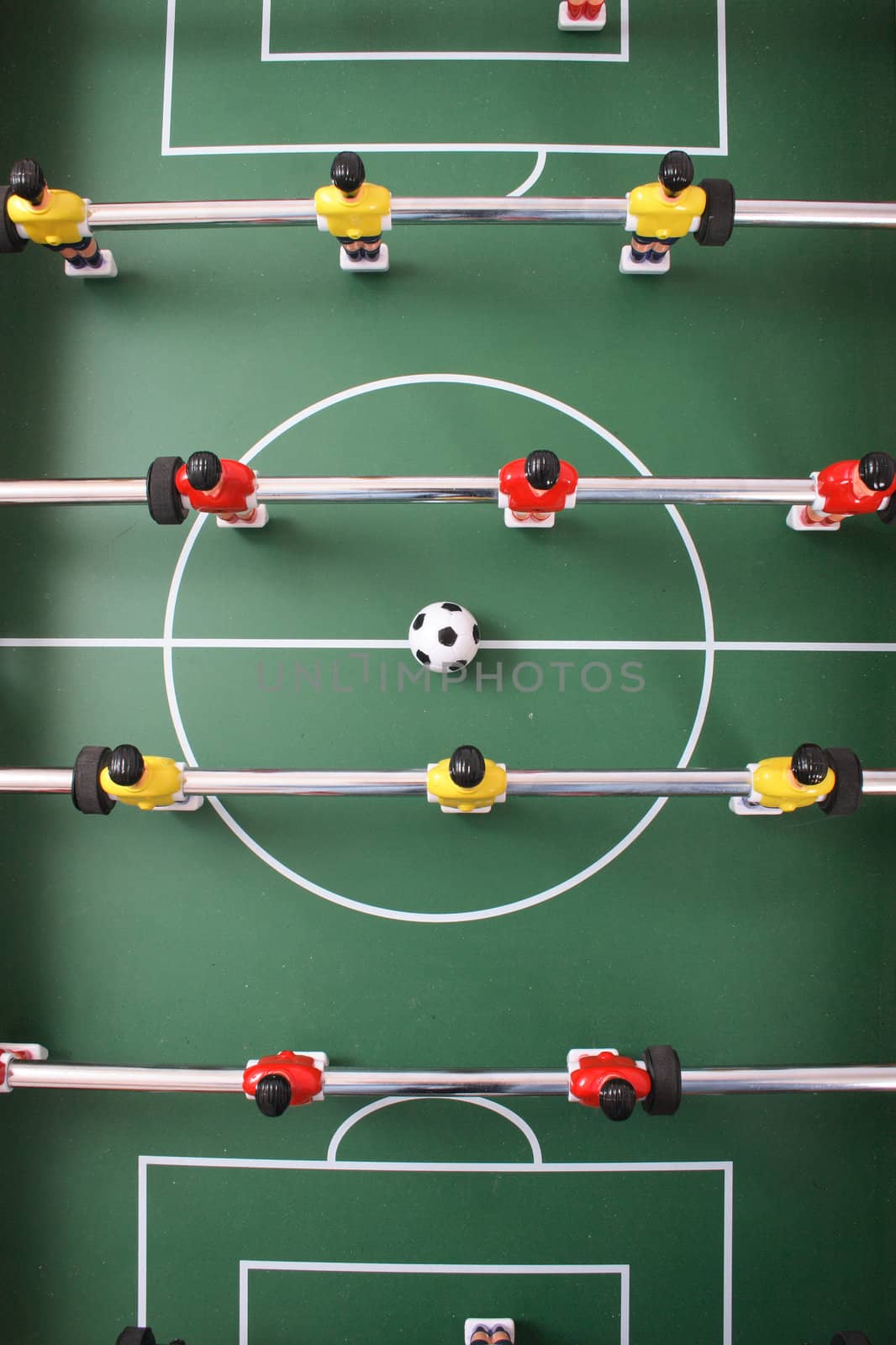 table soccer with players and a ball