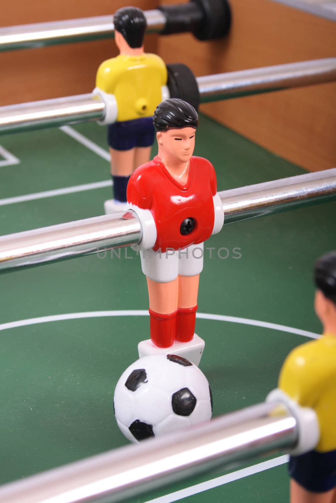 table soccer with players and a ball