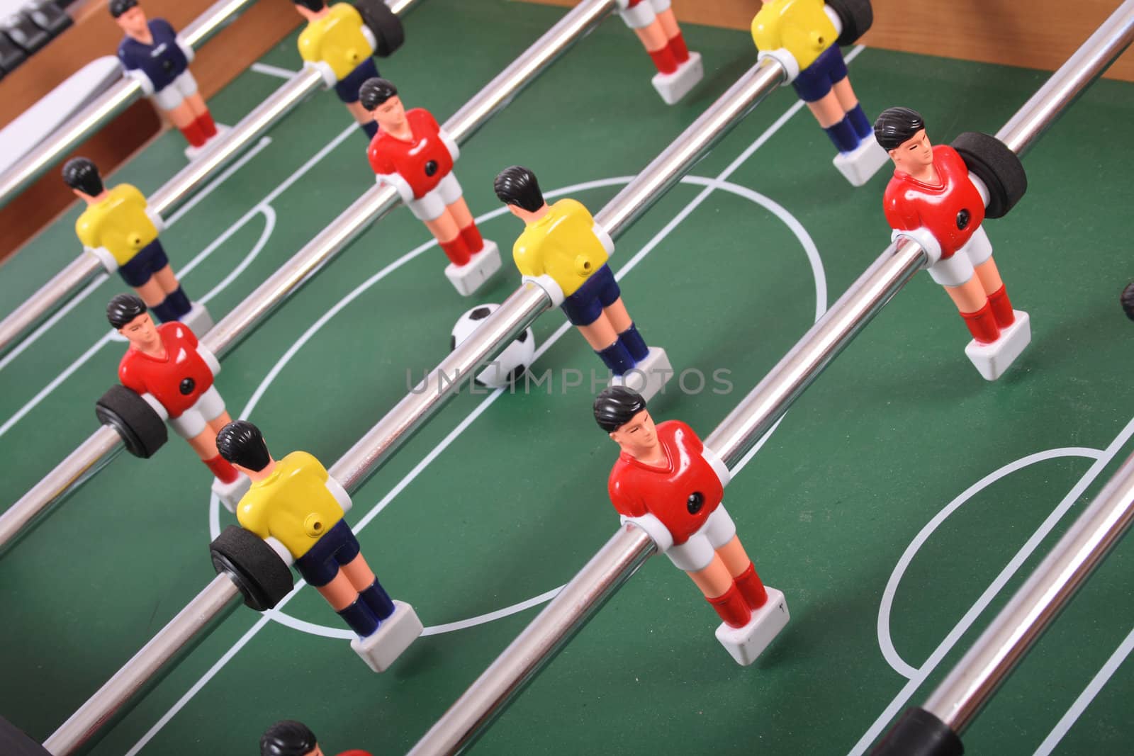 table soccer with players and a ball