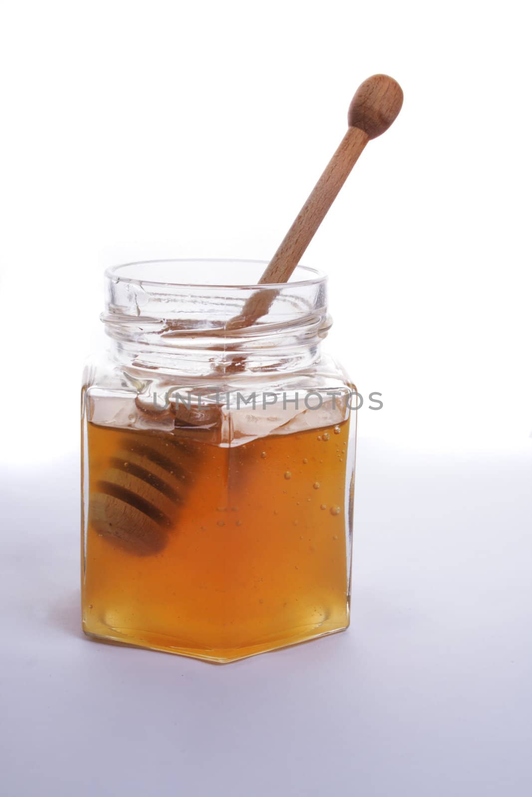 sweet honey isolated on the white background