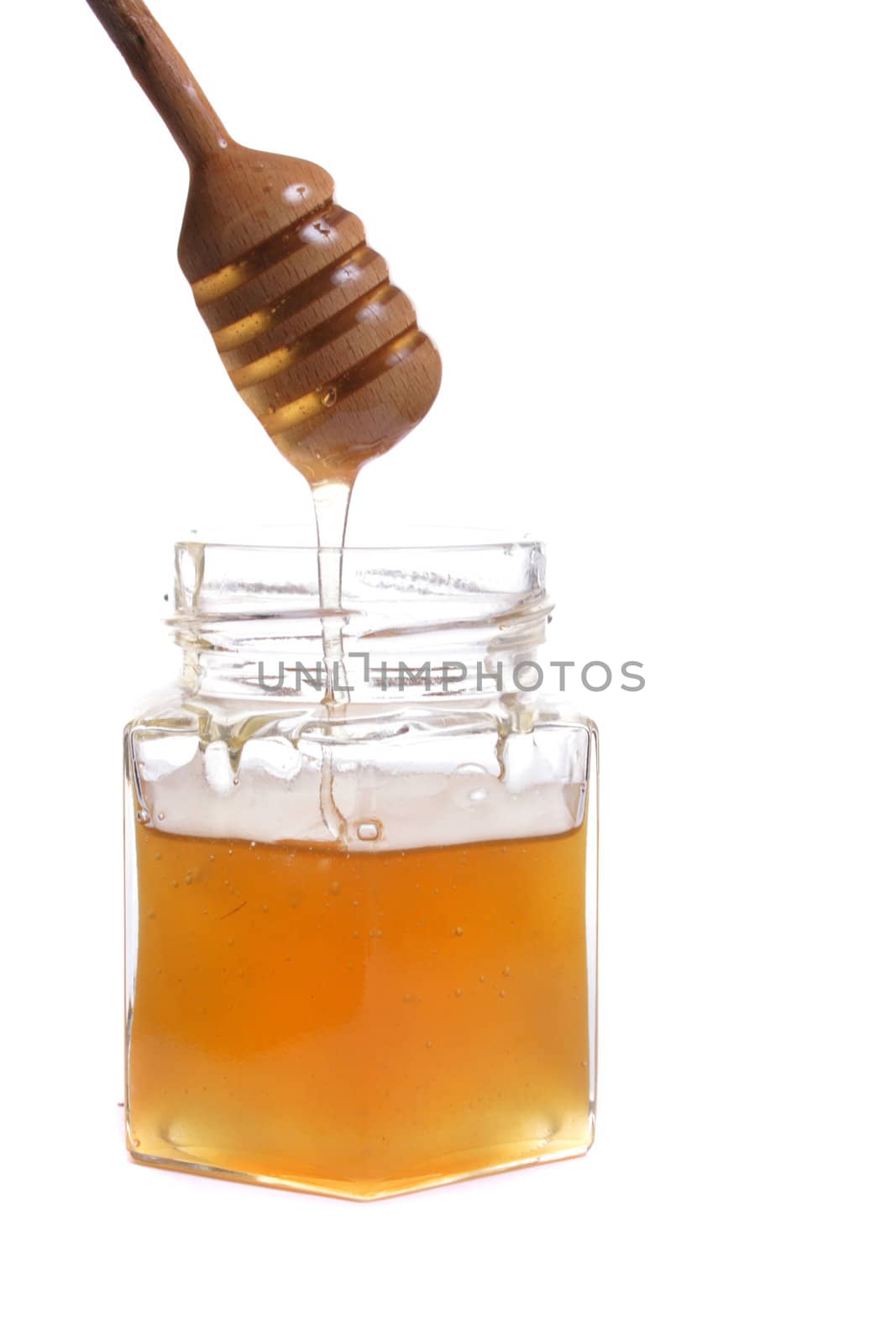 fresh honey isolated on the white background