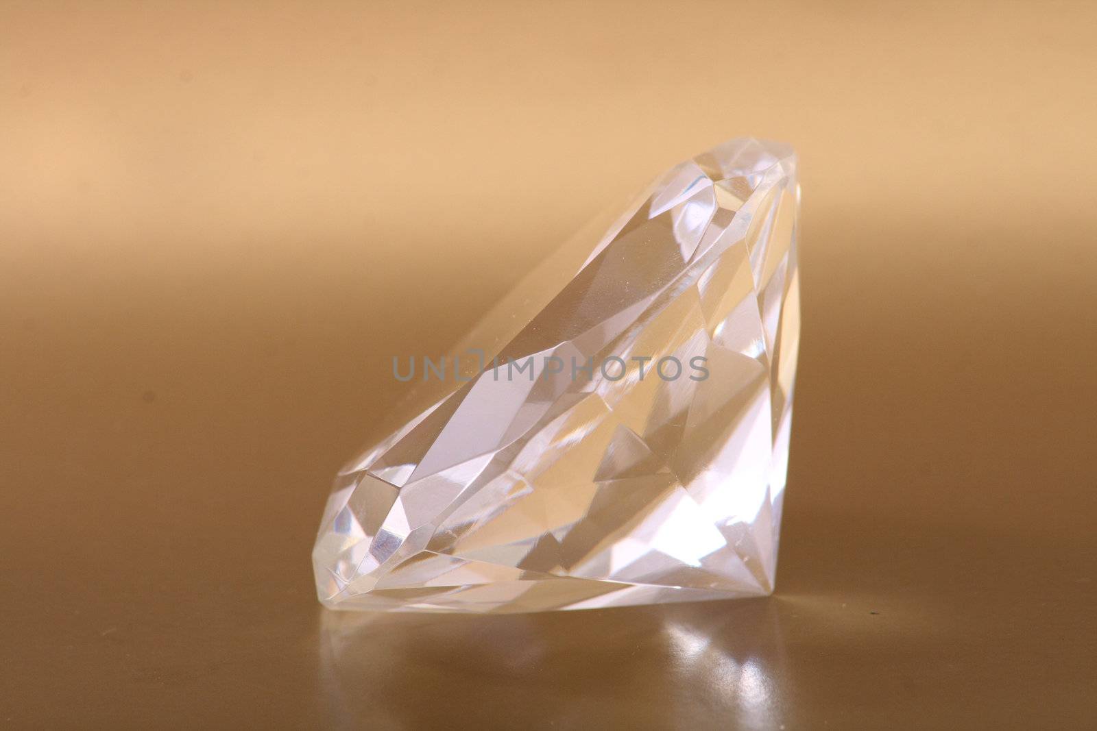 very nice diamond isolated on the golden background