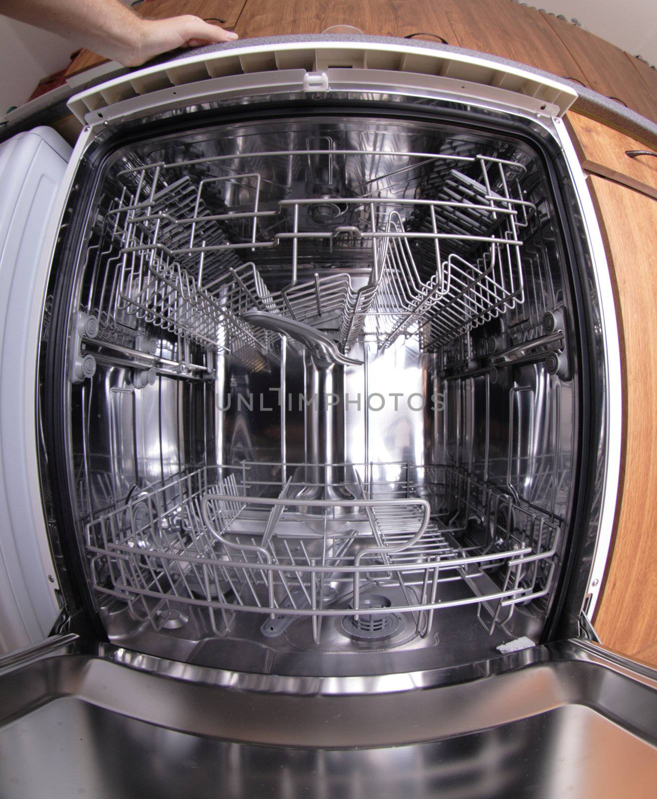 inside of empty and clear dishwasher machine 