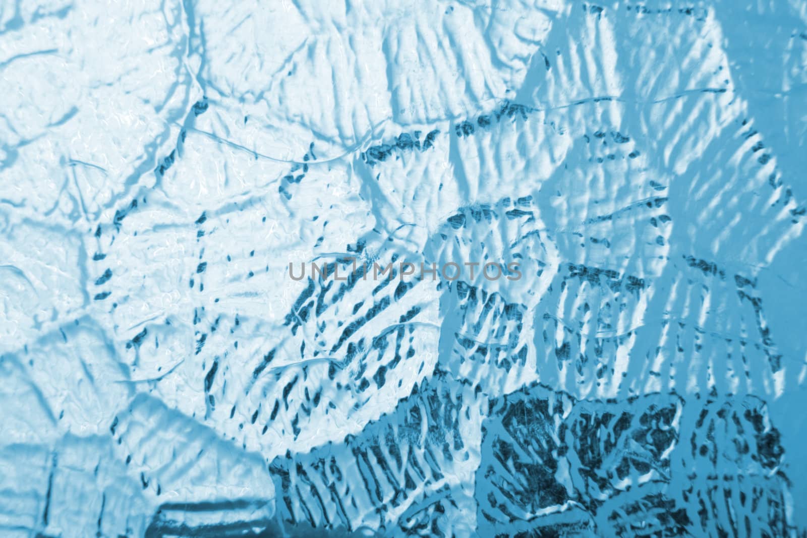 very nice blue ice background from the glass