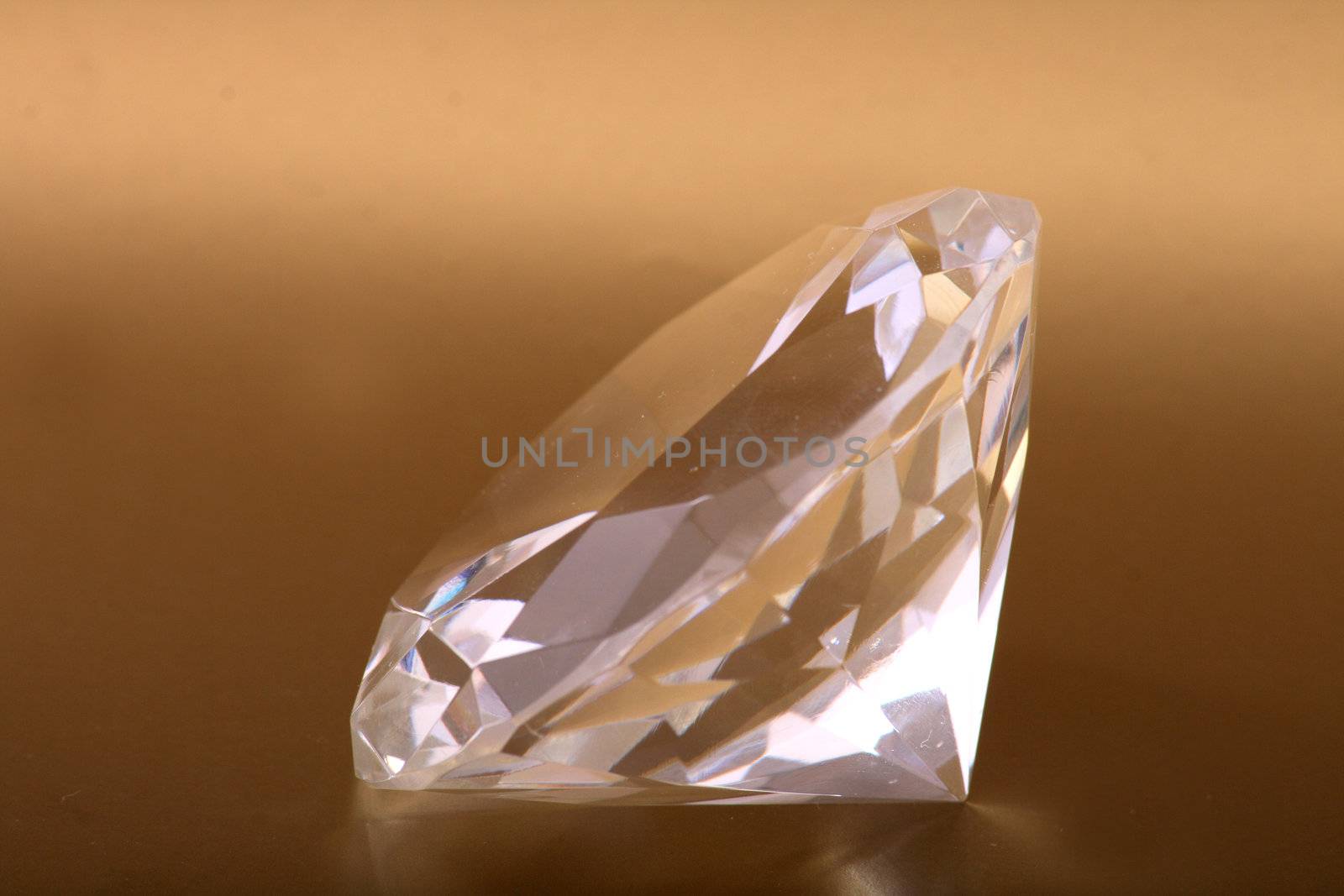 nice diamod isolated on the golden background