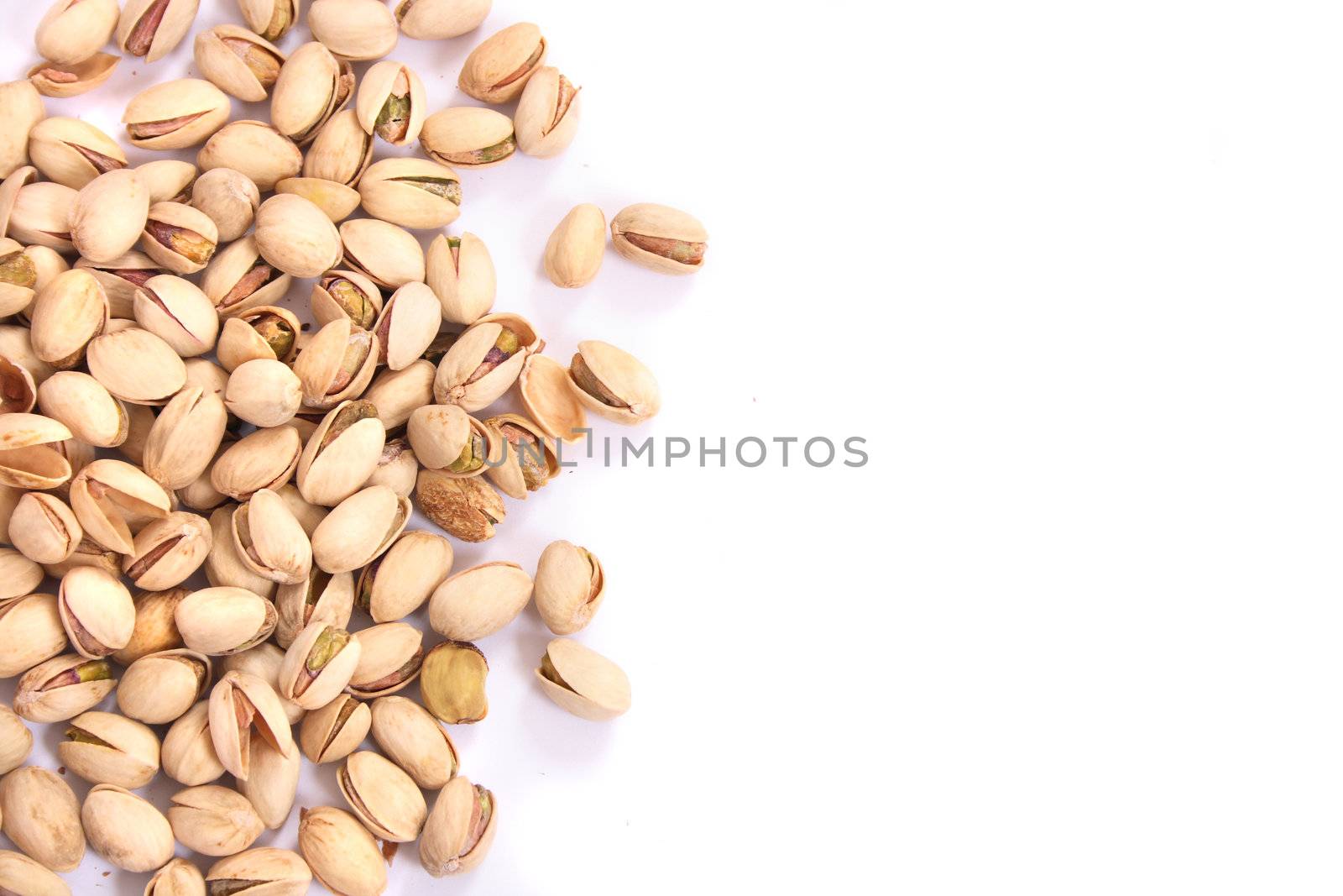 fresh salted pitachios on the white background