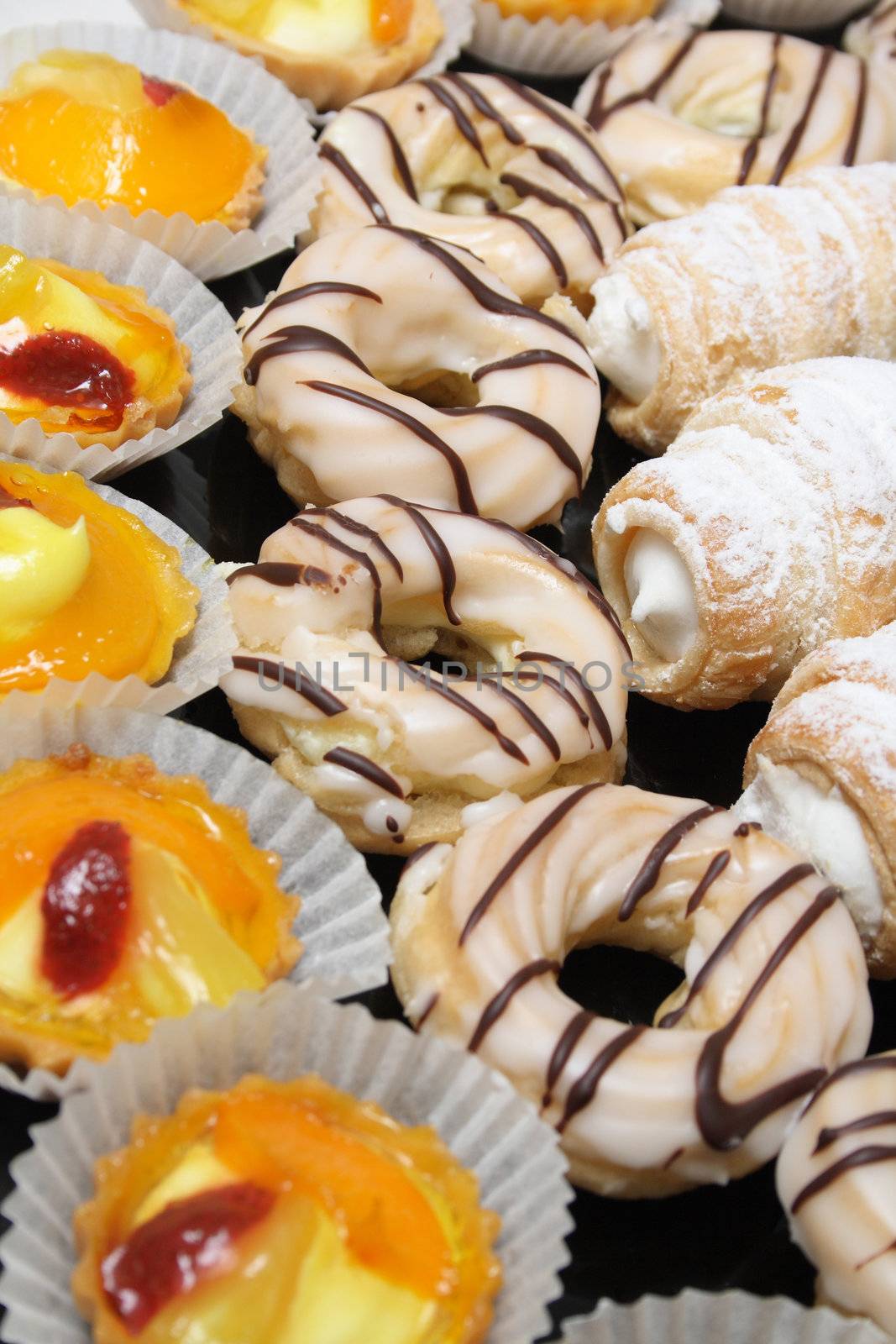 fresh sweet desserts on the black background 