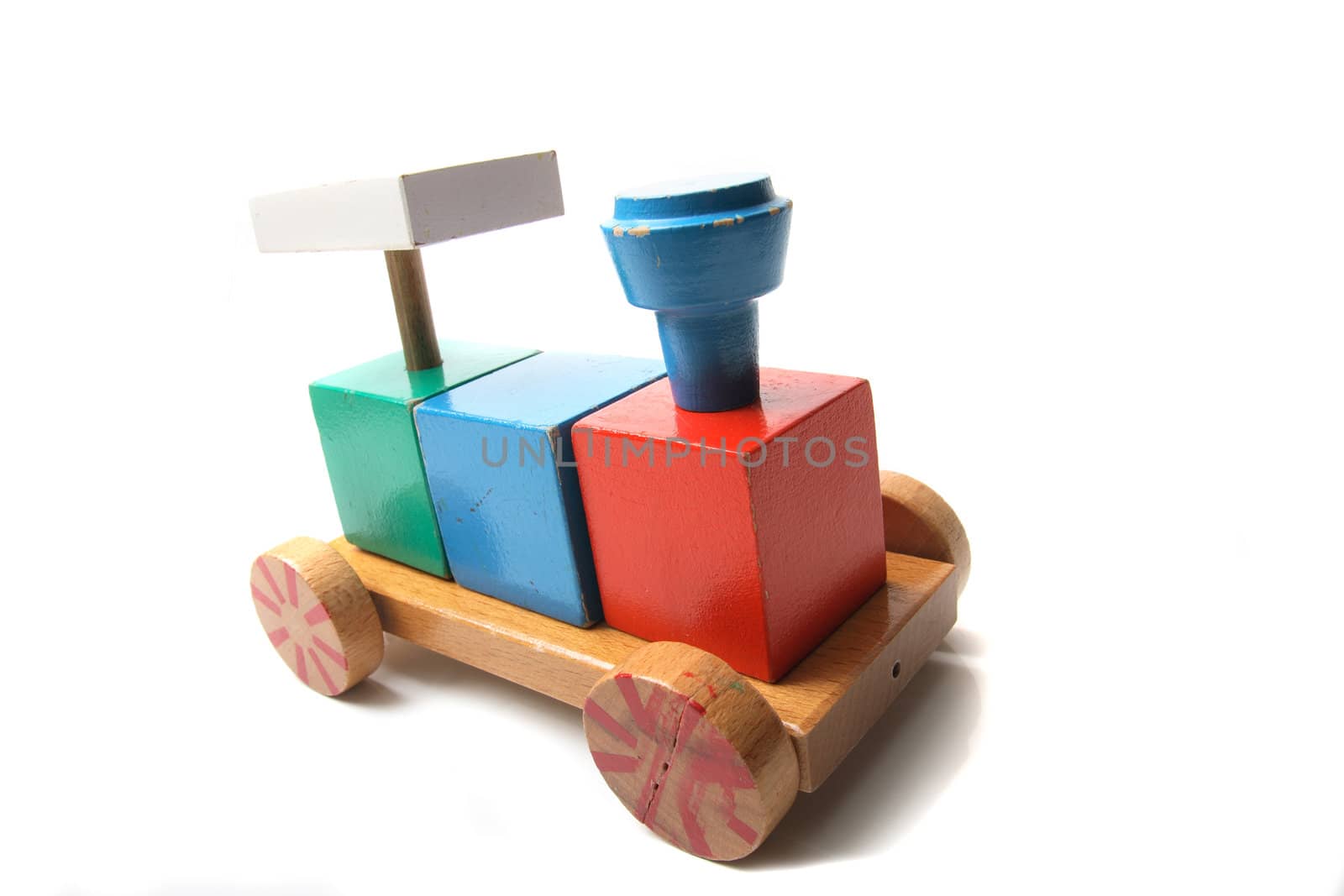 color wooden toy on the white background 