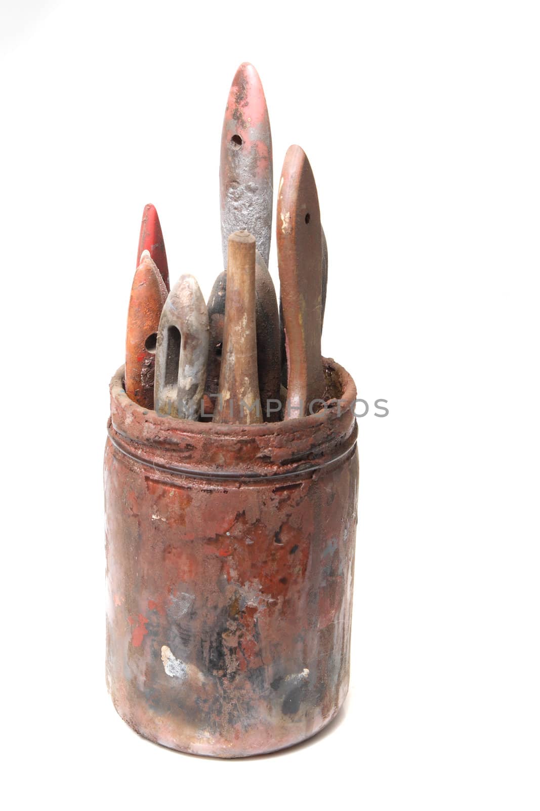 old paint brushes on the white background 