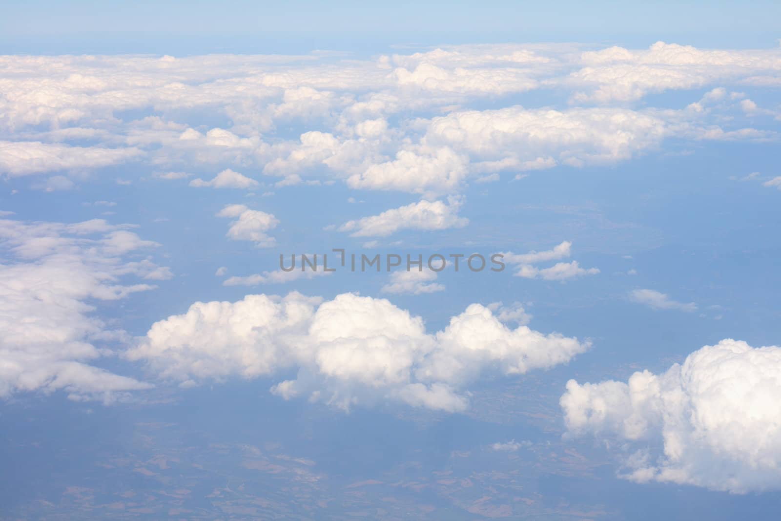 white clouds from the sky onm the blue background