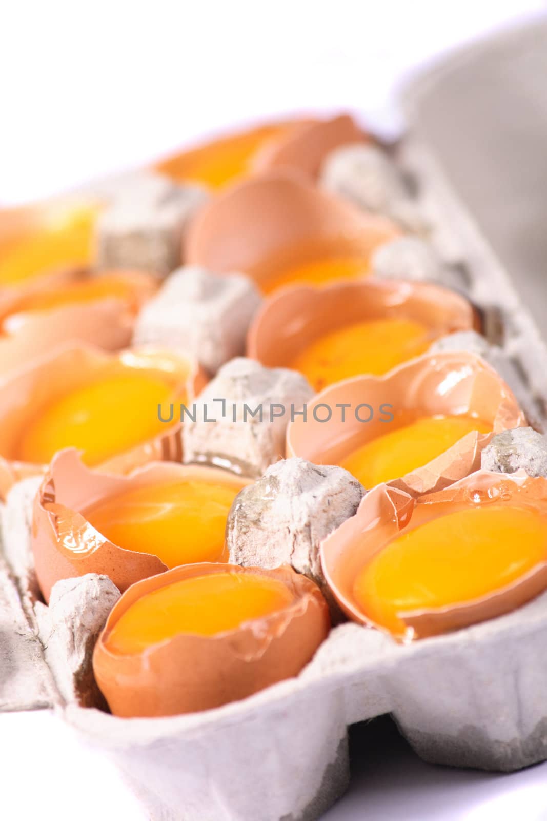 raw yellow eggs in the paper box 