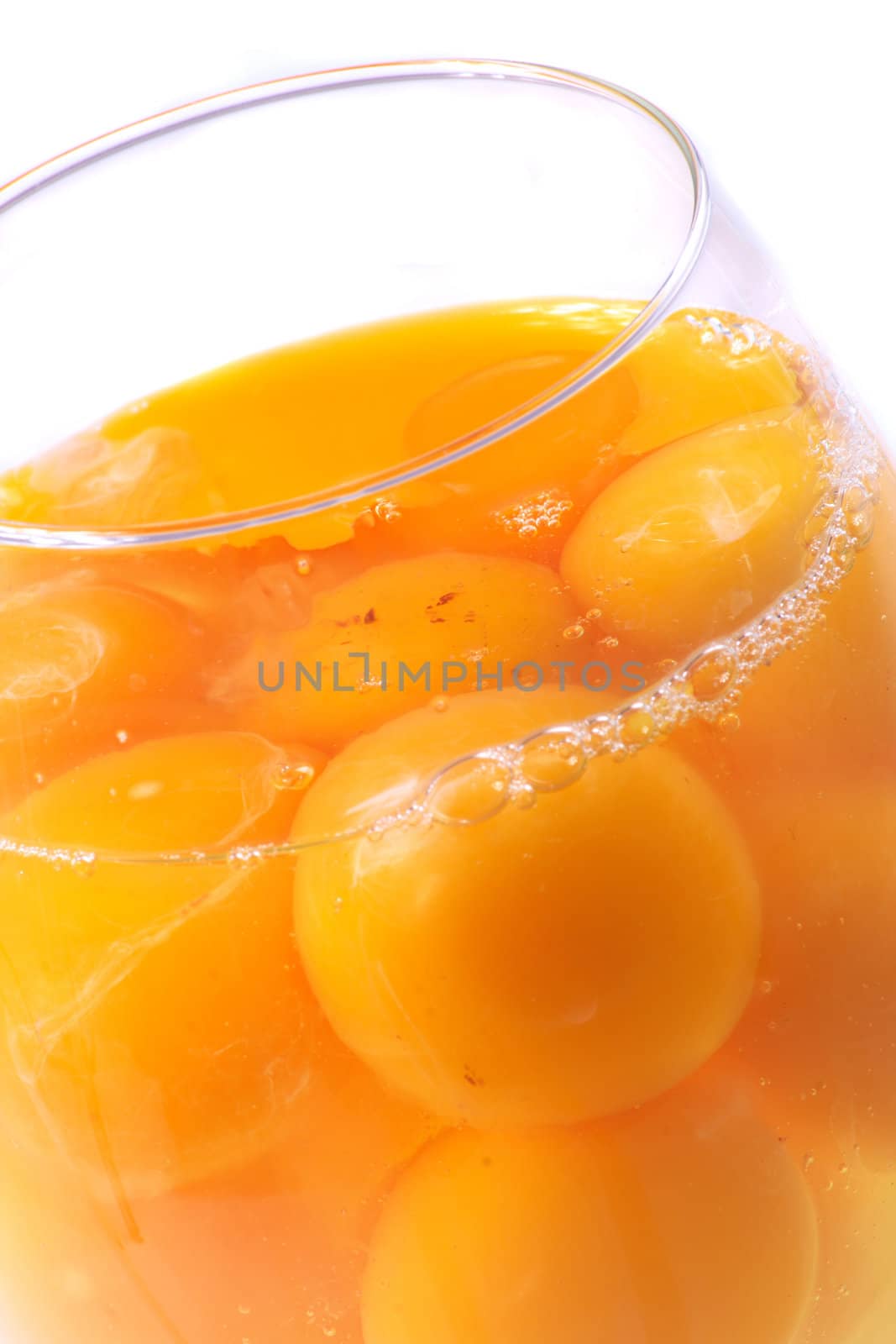 raw yellow eggs on the white background 
