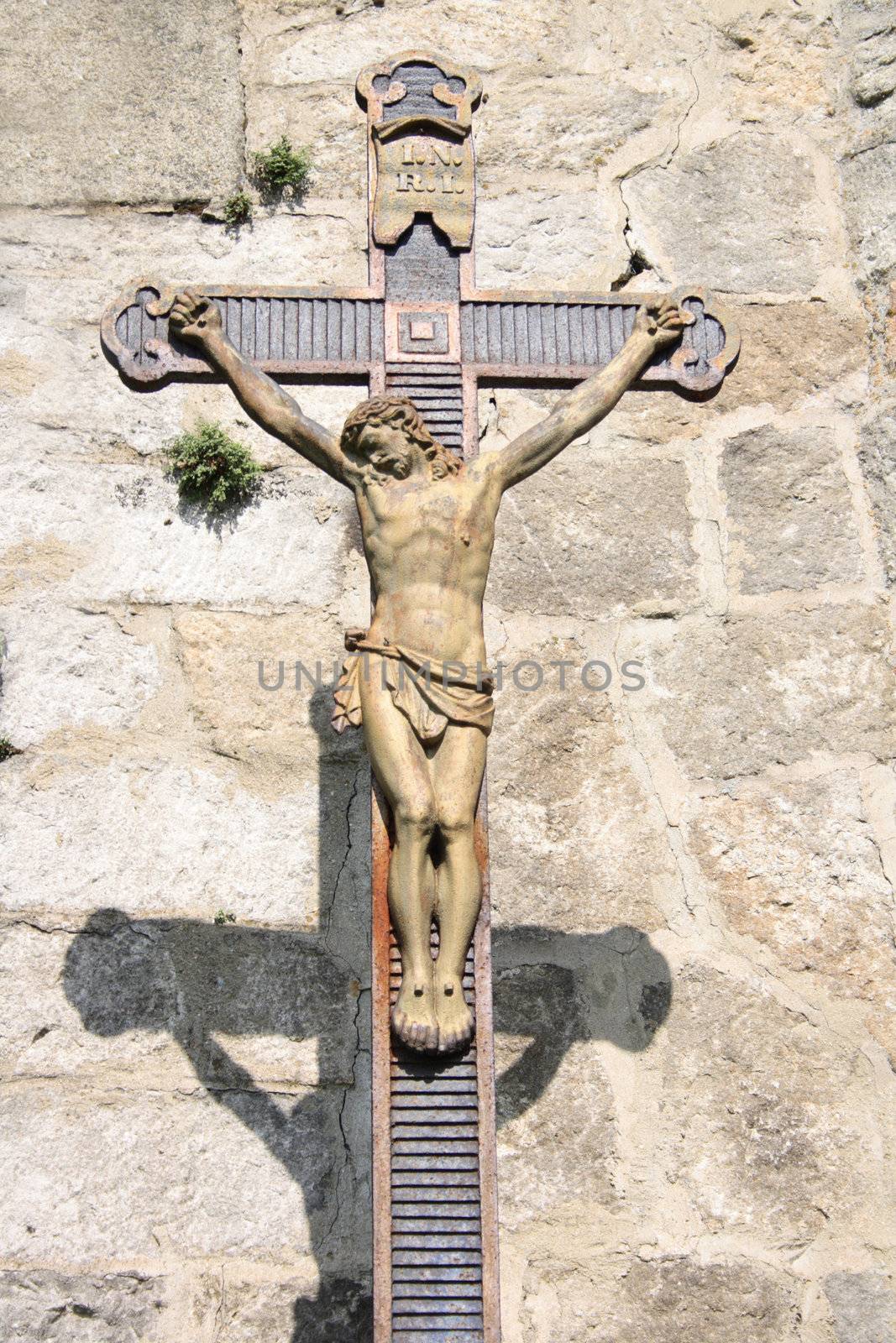 nice metal crucifix on the stone background