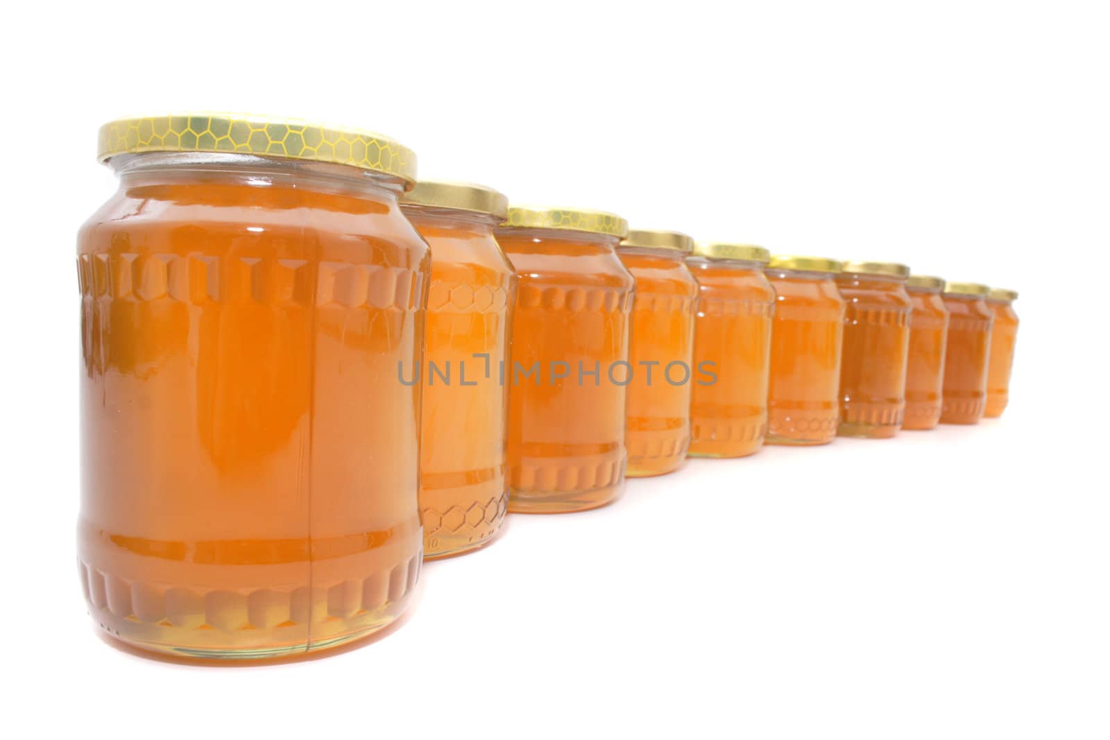 fresh honey isolated on the white background