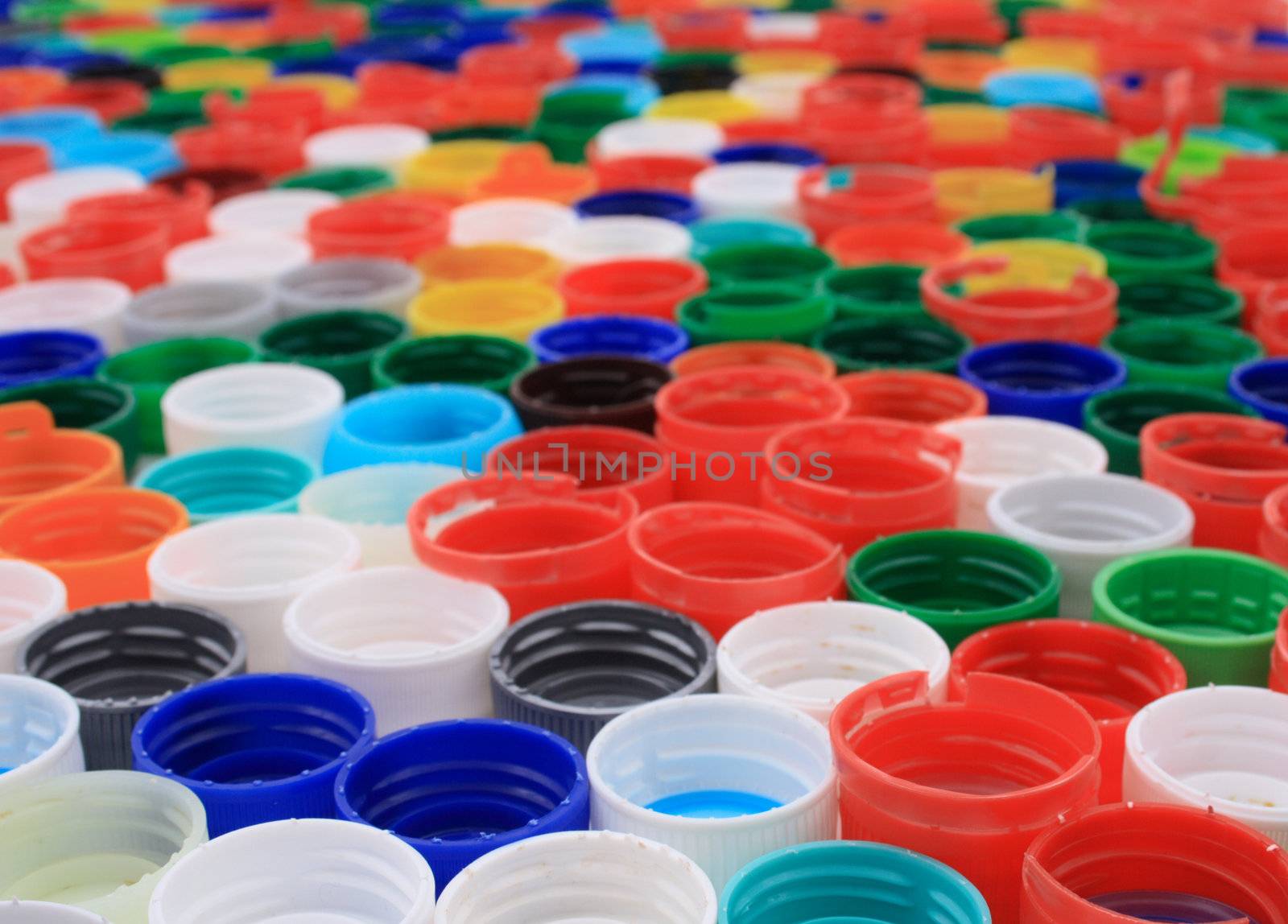plastic background from the rainbow used caps