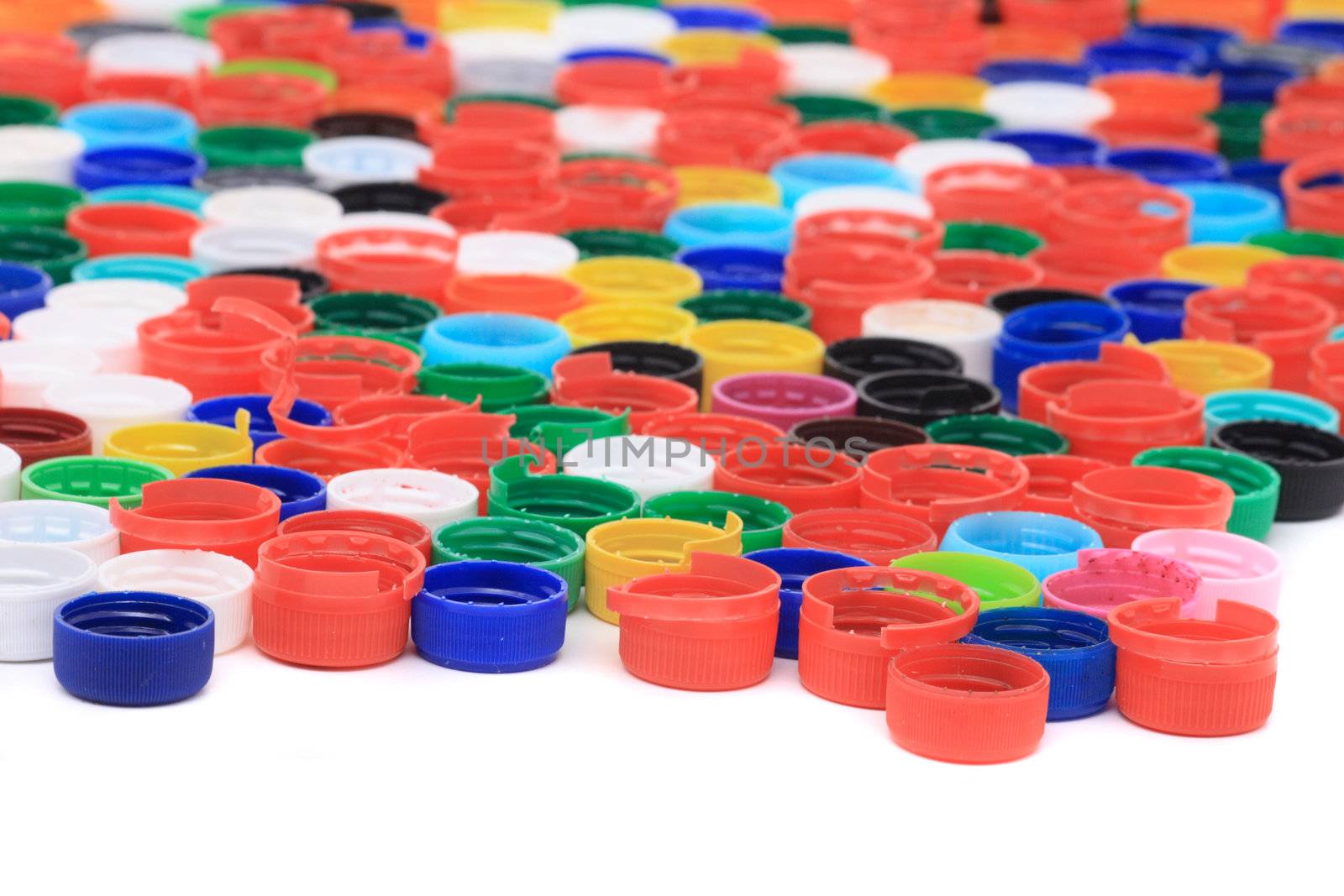 rainbow background from different colors plastic caps 