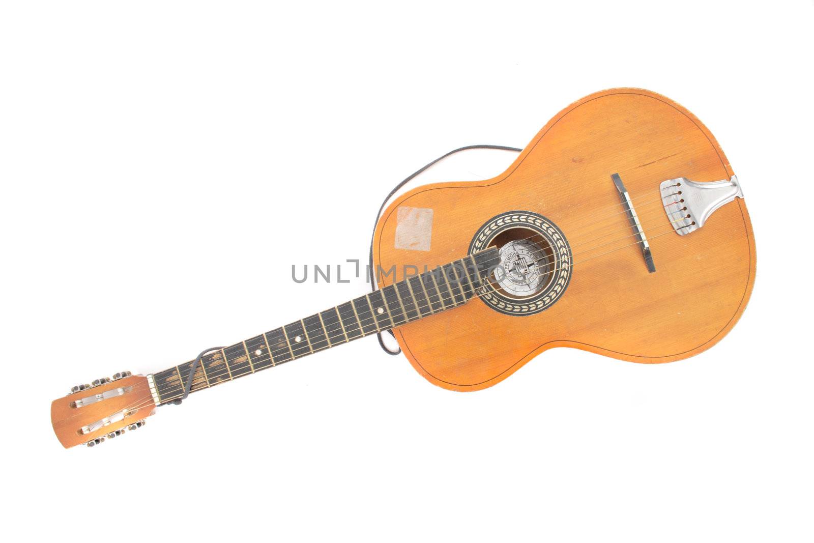 old guitar isolated on the white background