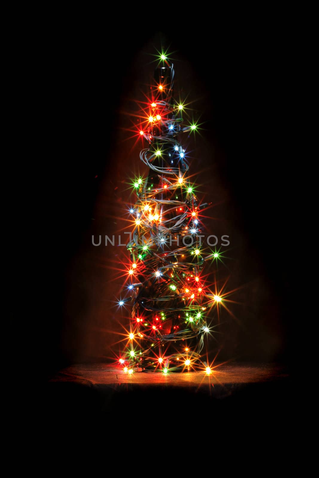 christmas bottle with color lights in the dark night