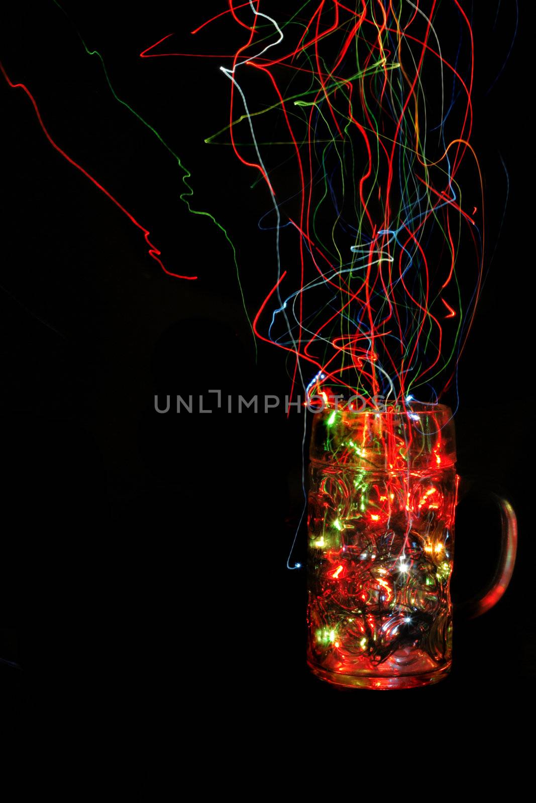 empty christmas glass cup with color lights in the dark night