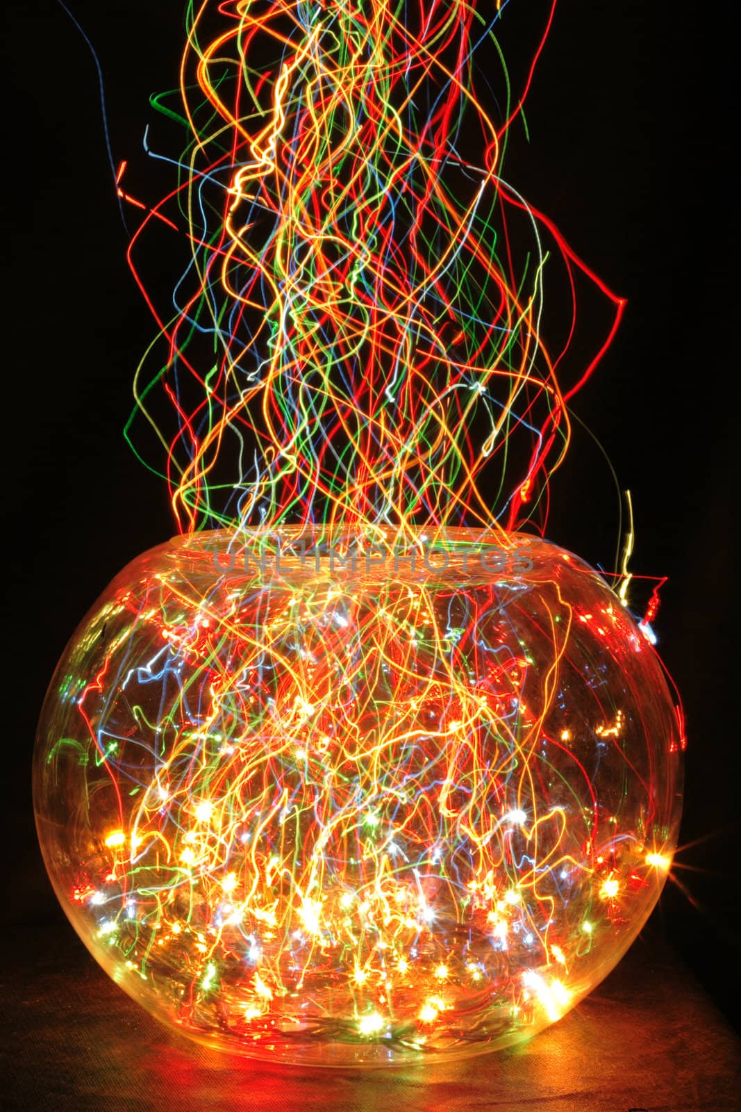 christmas glass sphere with color lights in the dark night