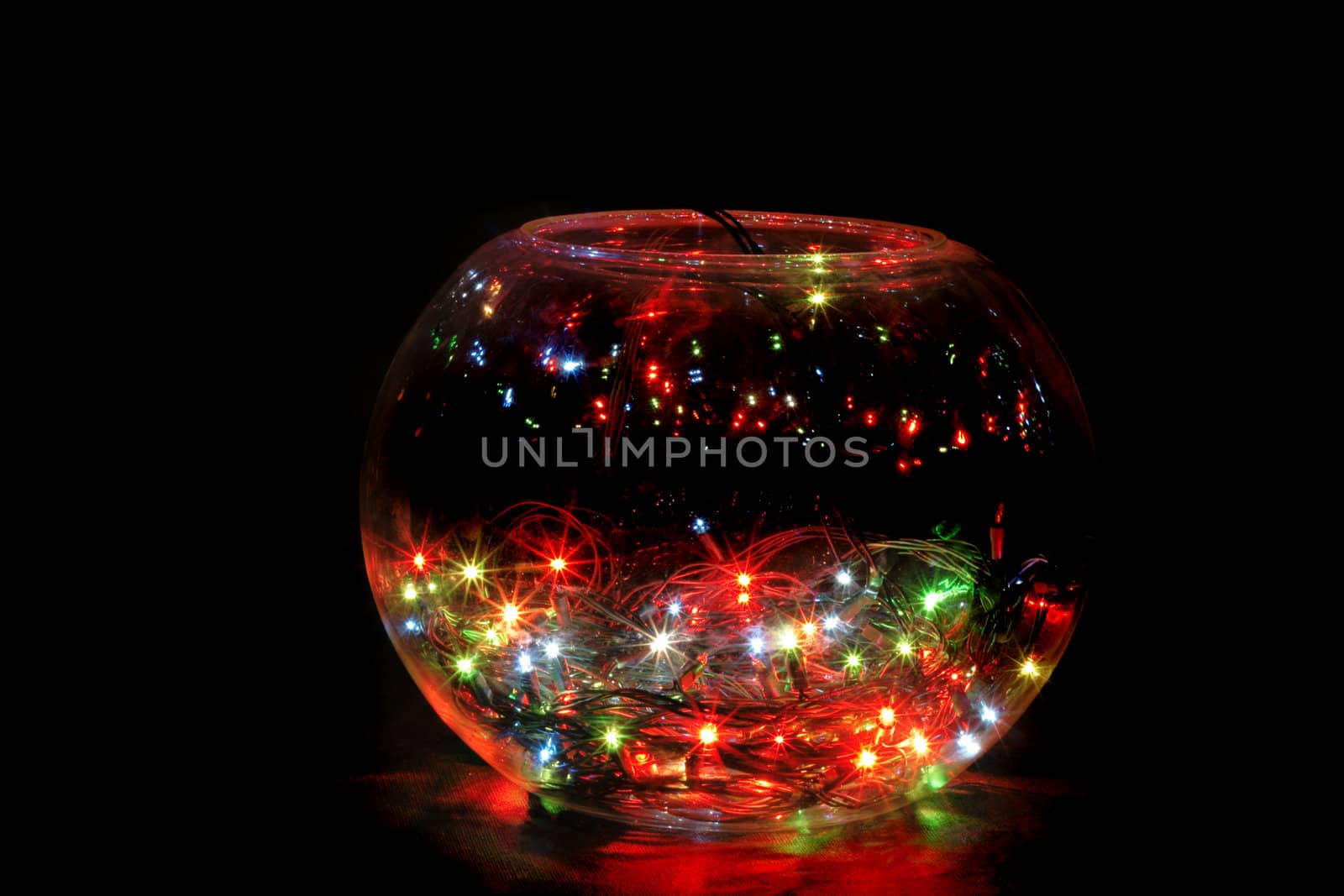 christmas glass sphere with color lights in the dark night