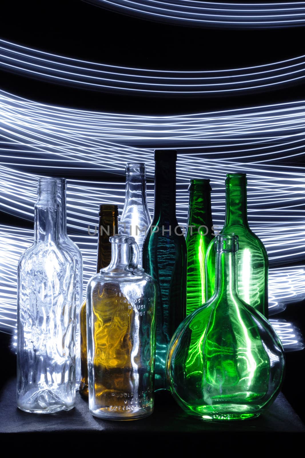 empty color bottles in the dark night