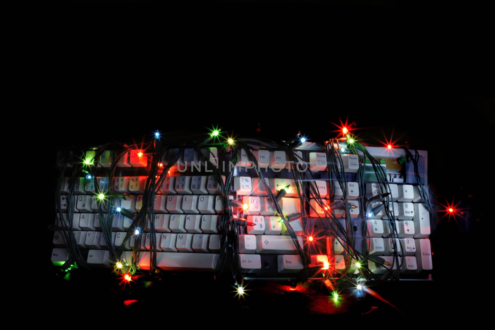 christmas keyboard in the dark night with the color lights 