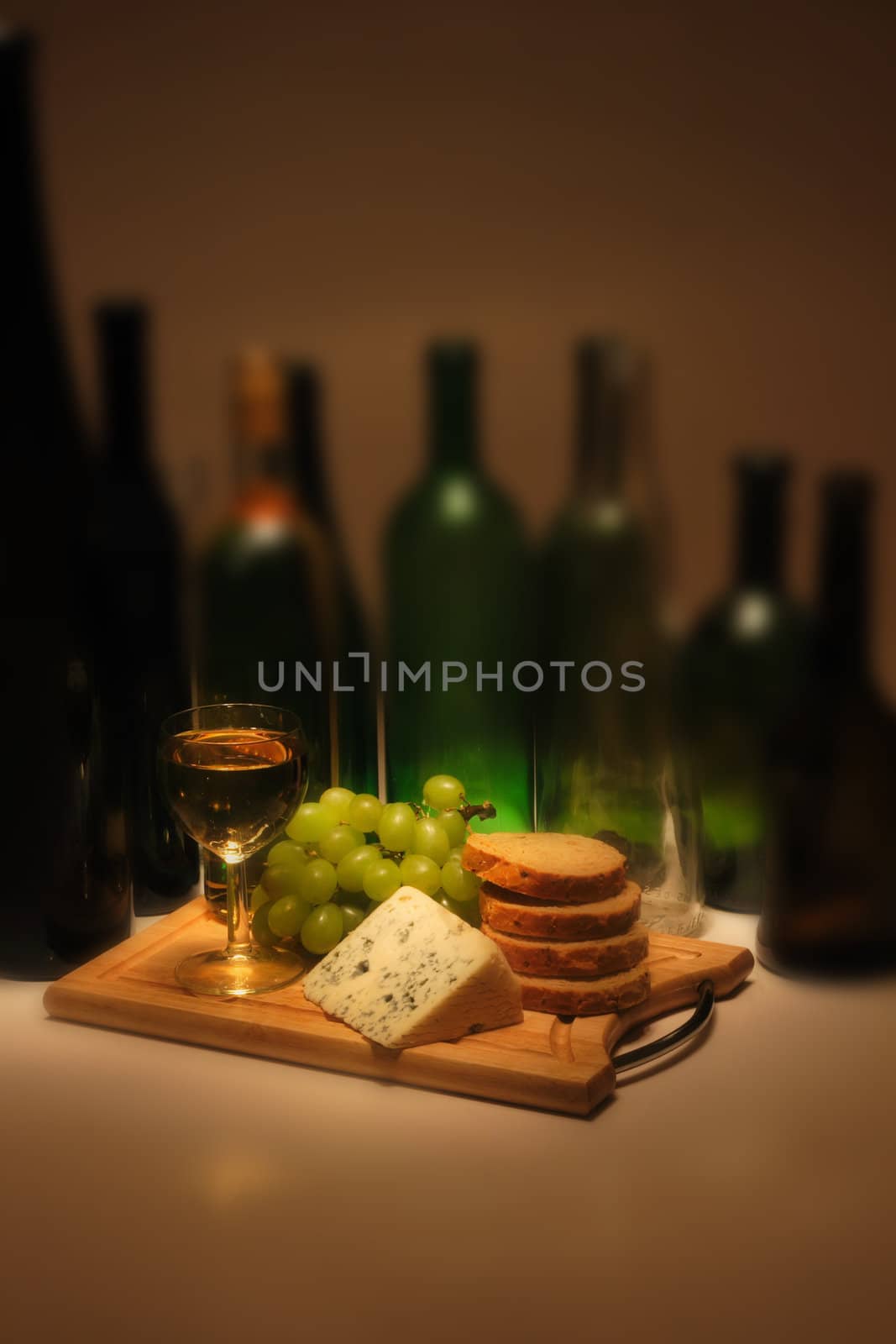 wine and cheese dinner in the dark night