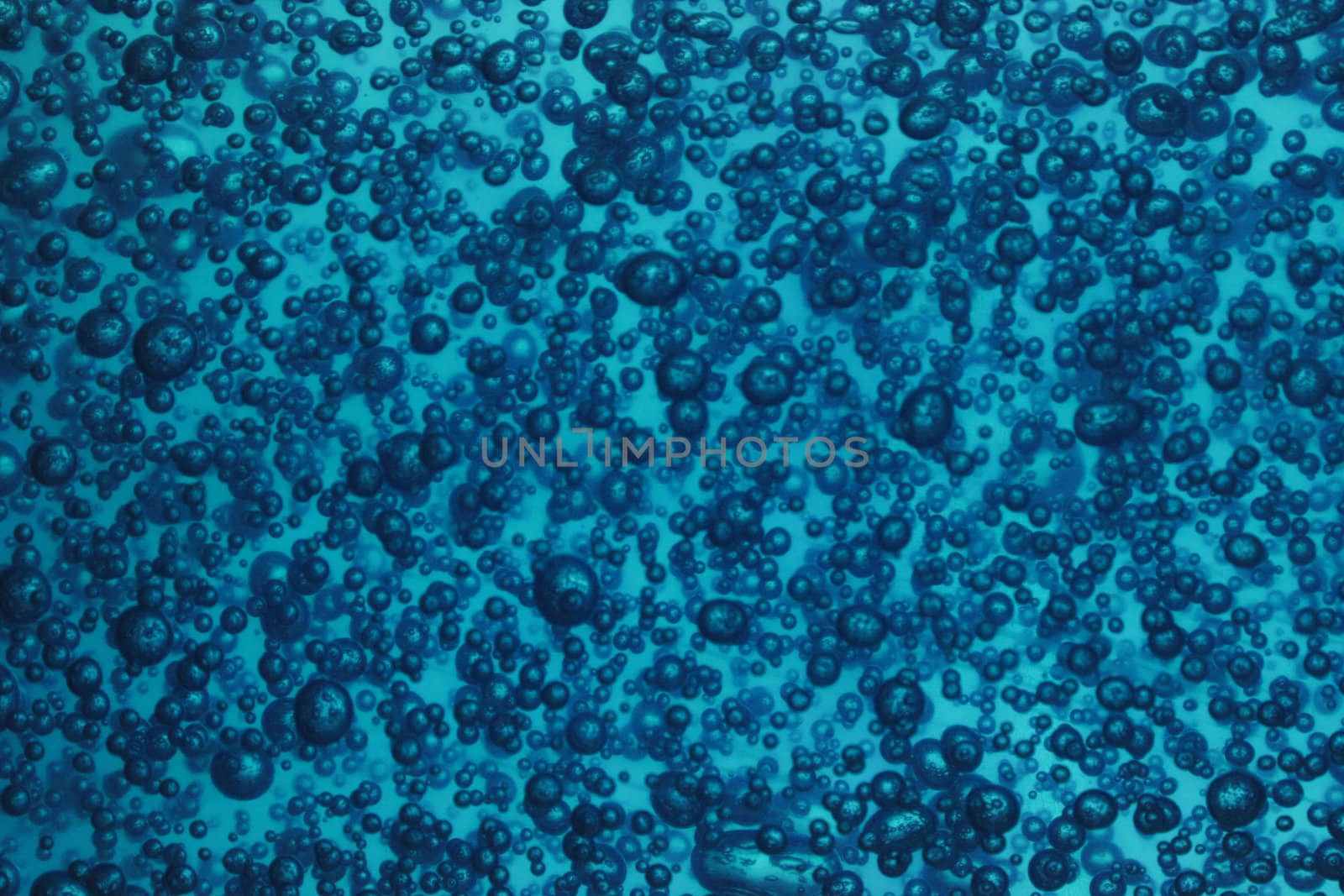 natural blue water background with oxygen bubbles