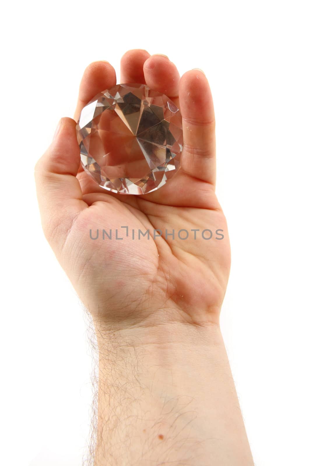 diamond in the hand isolated on the white background