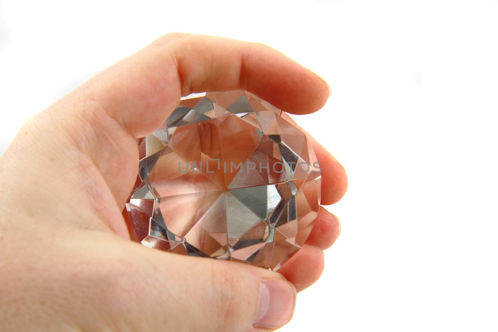 diamond in the hand isolated on the white background