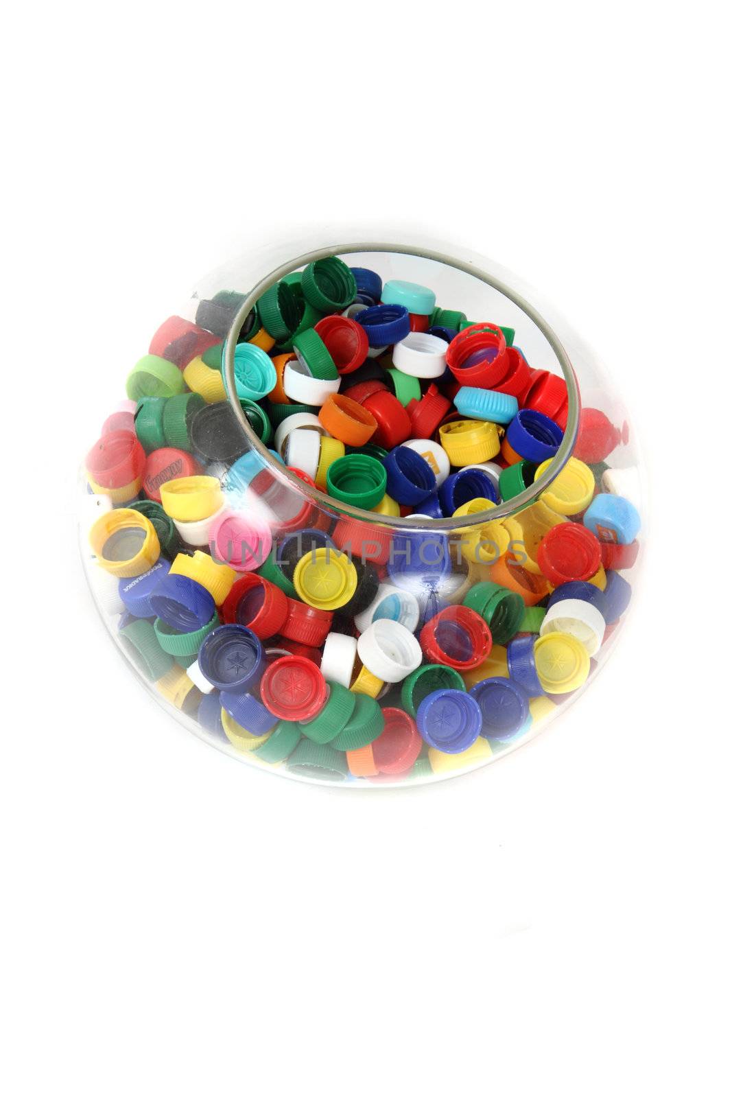 plastic caps in the glass sphere isolated on the white background