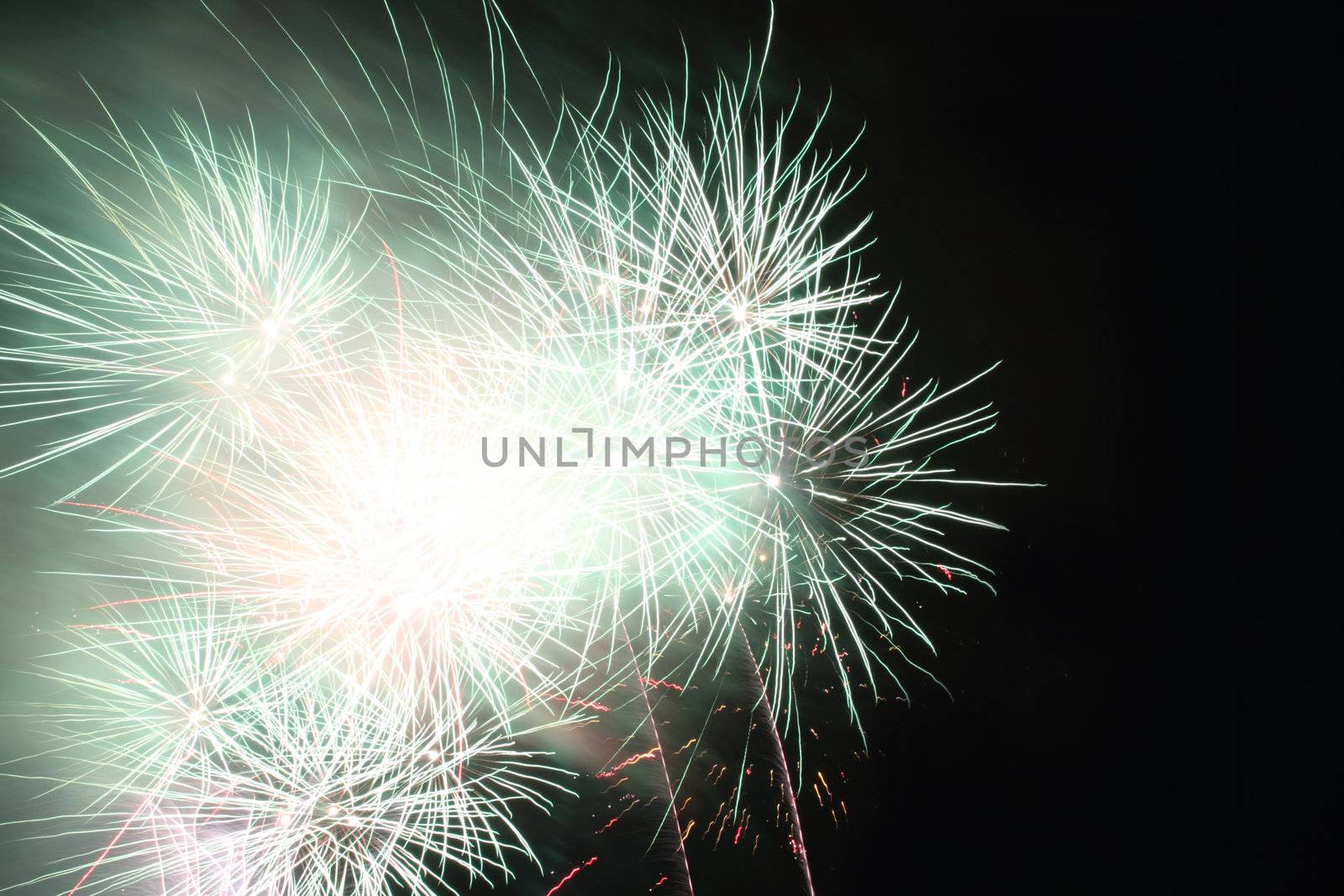 color fireworks in the dark night as holiday background