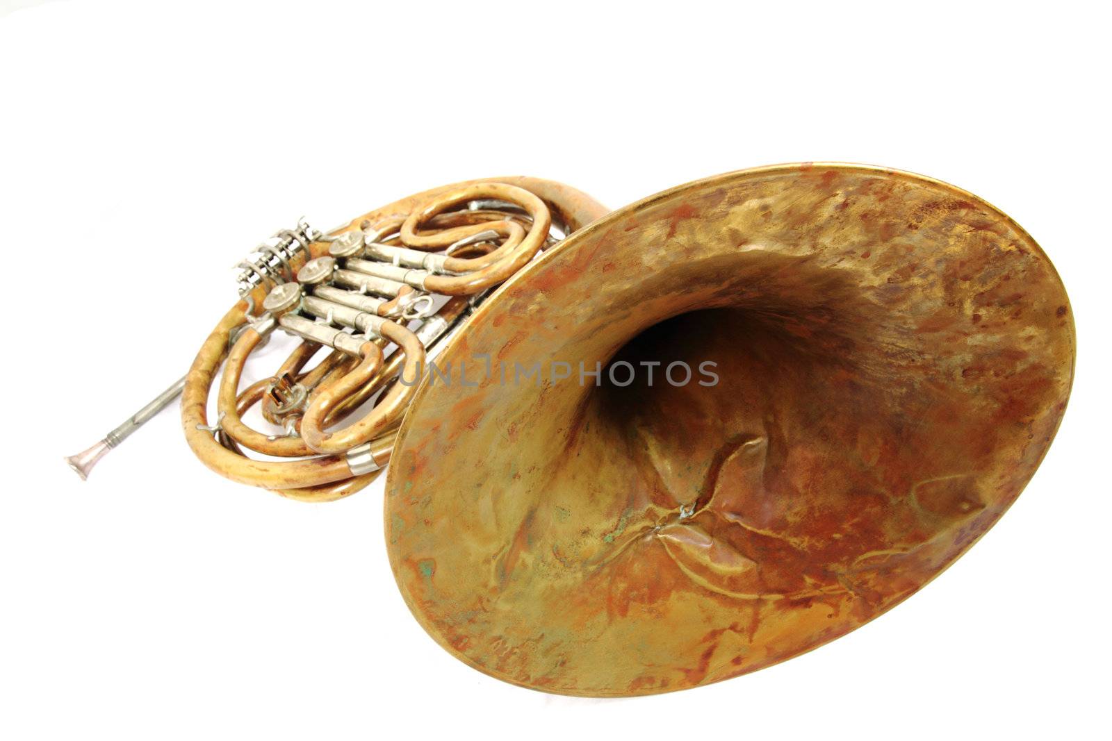 old french horn isolated on the white background