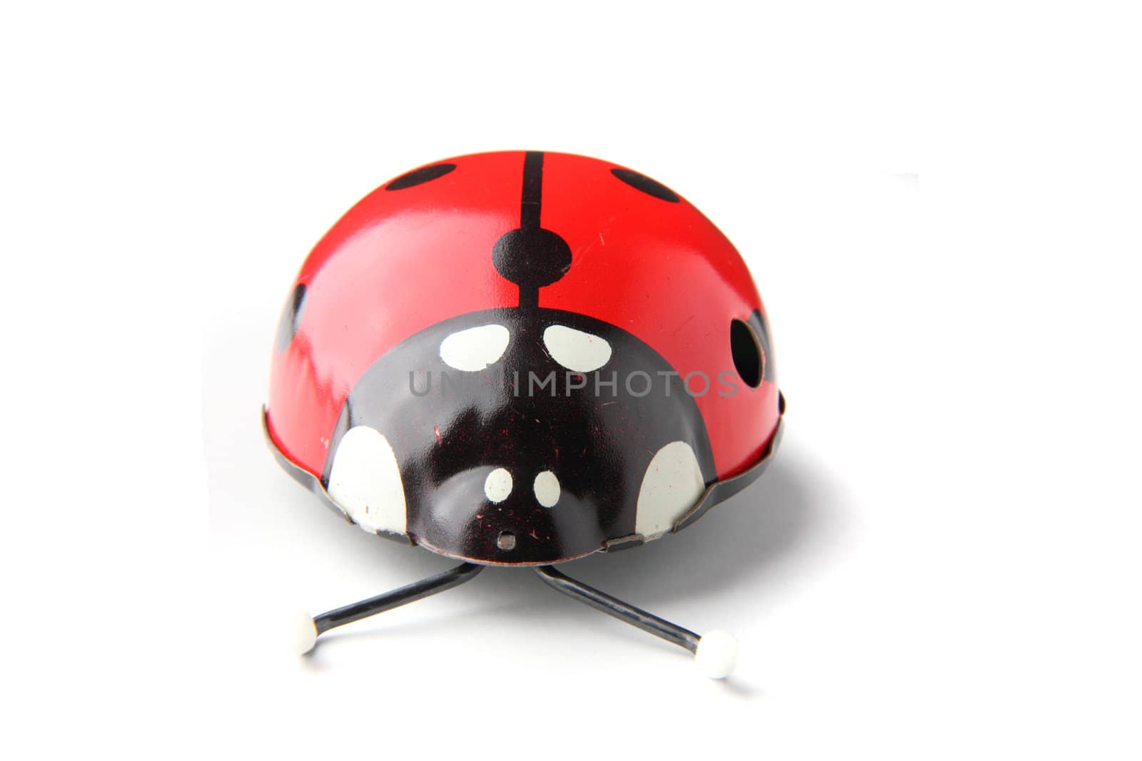 old red ladybird toy isolated on the white background