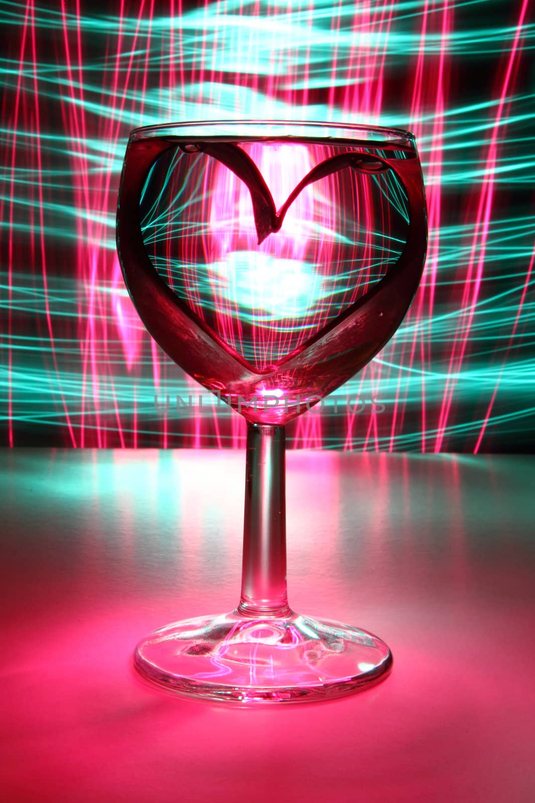 valentine heart in the glass of water in the dark night