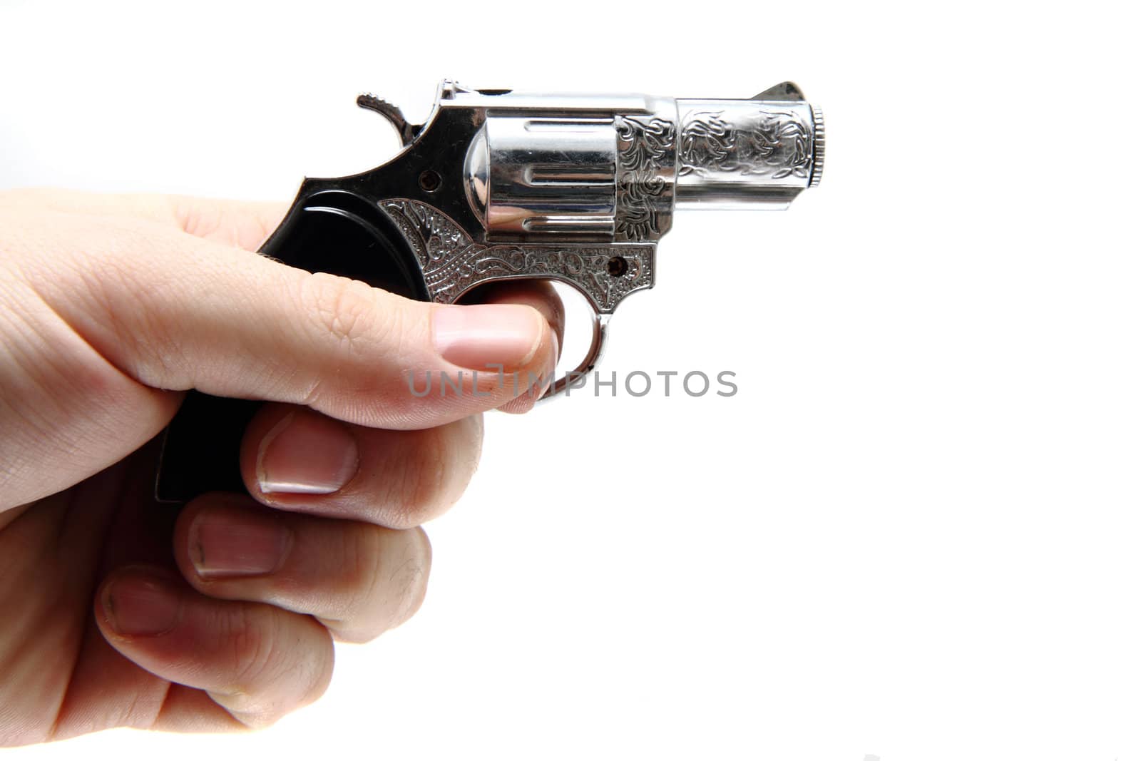small hand gun in the hand isolated on the white background