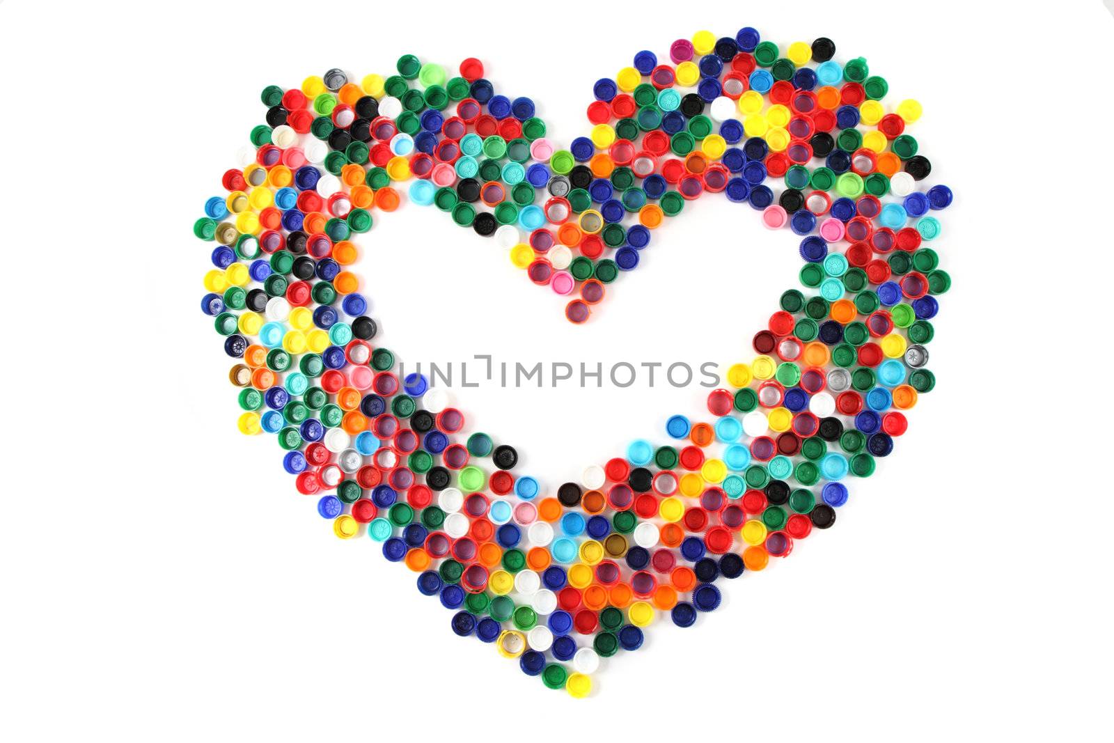 heart from the color plastic caps isolated on the white background
